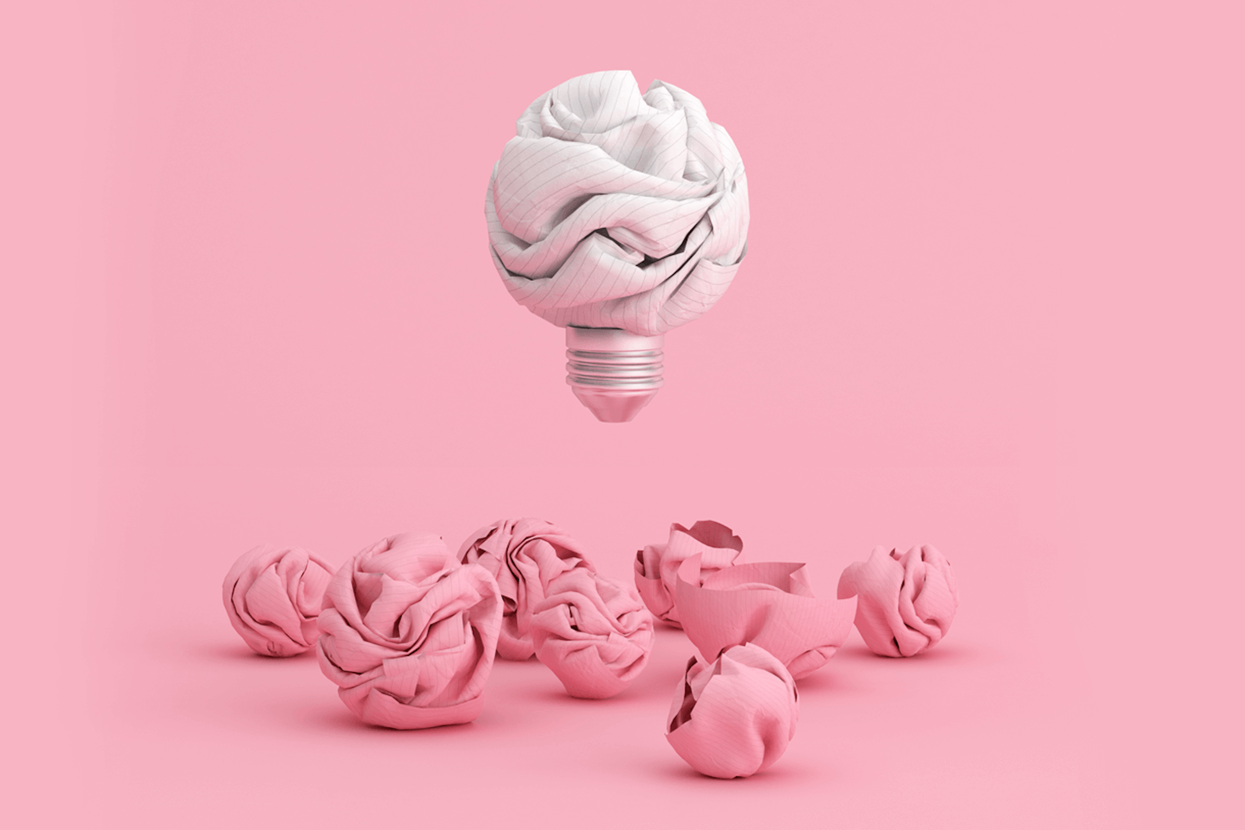 Illustration einer Glühbirne als zerknittertes weißes Blatt Papier, das über mehreren zerknitterten Stücken rosa Papier schwebt. Ideen für die Erstellung von Inhalten Blog Post