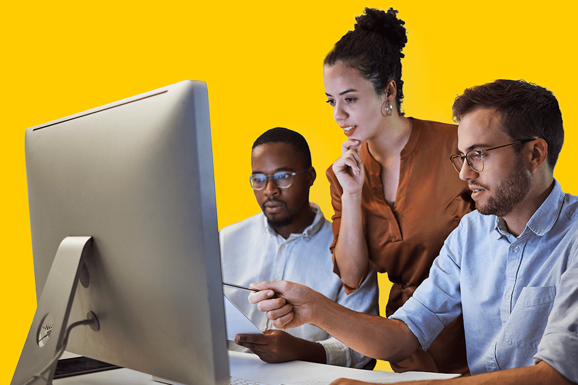 3 people looking at a computer screen