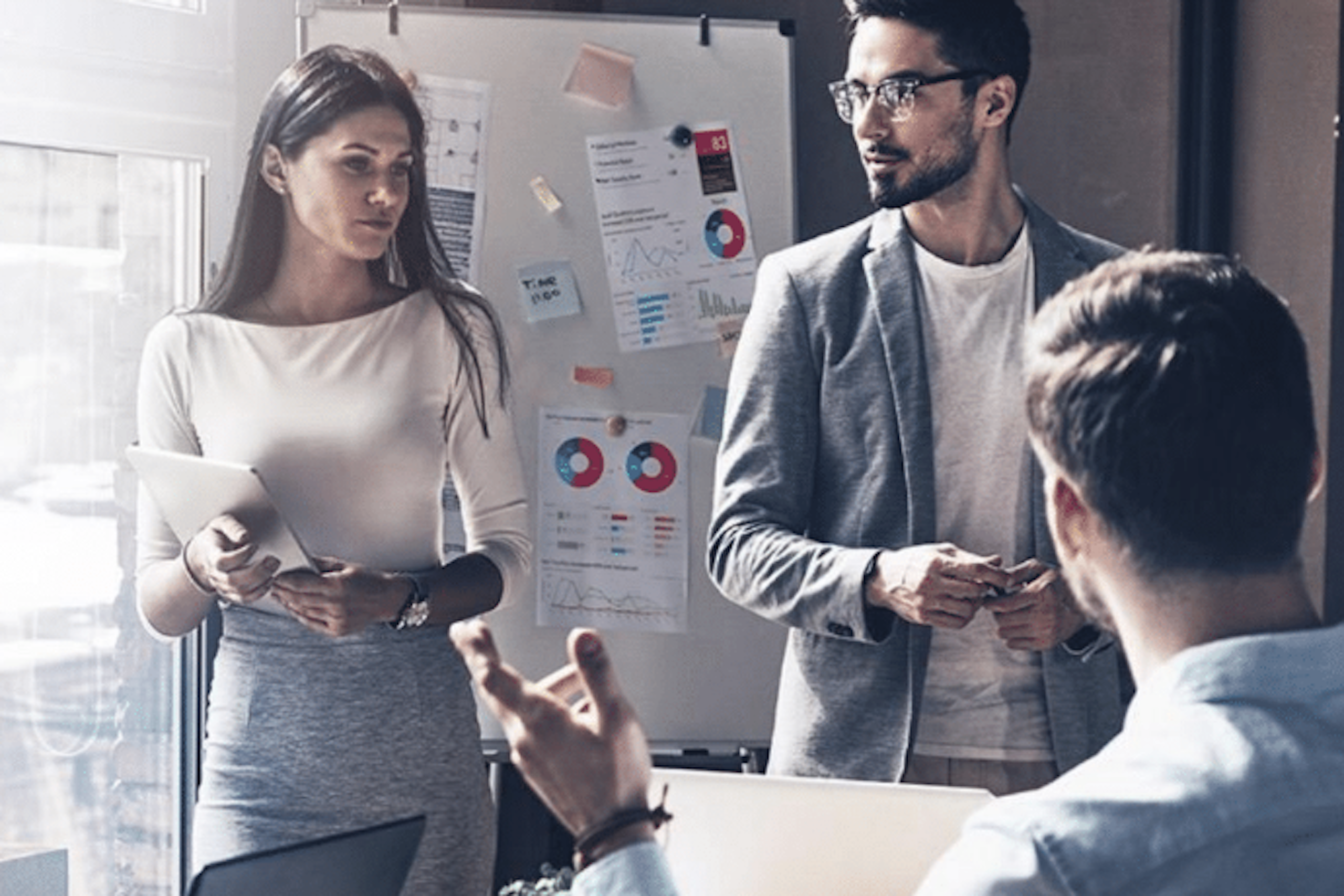 People gathered in an office having a meeting.