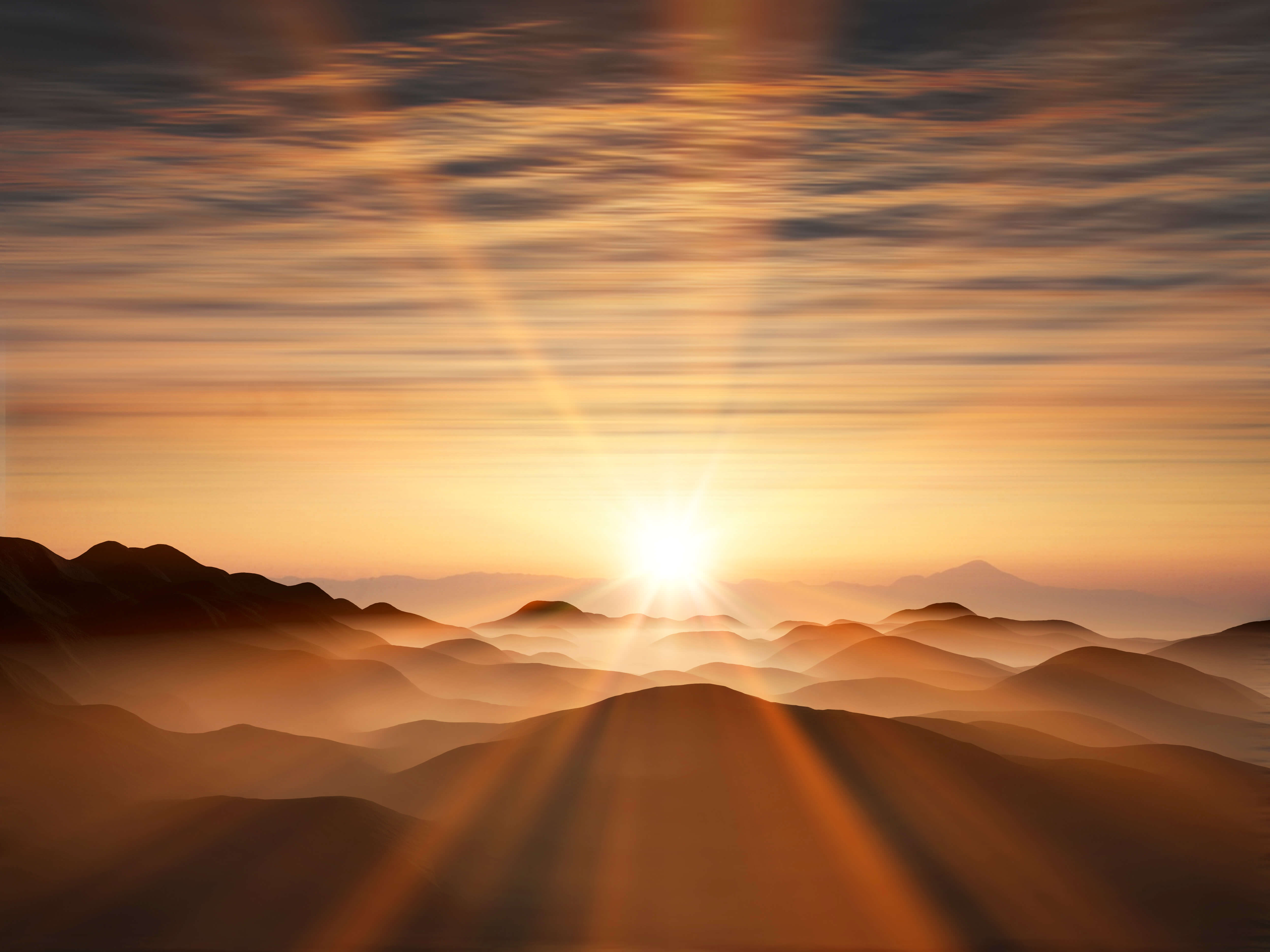 山間からの日の出の画像