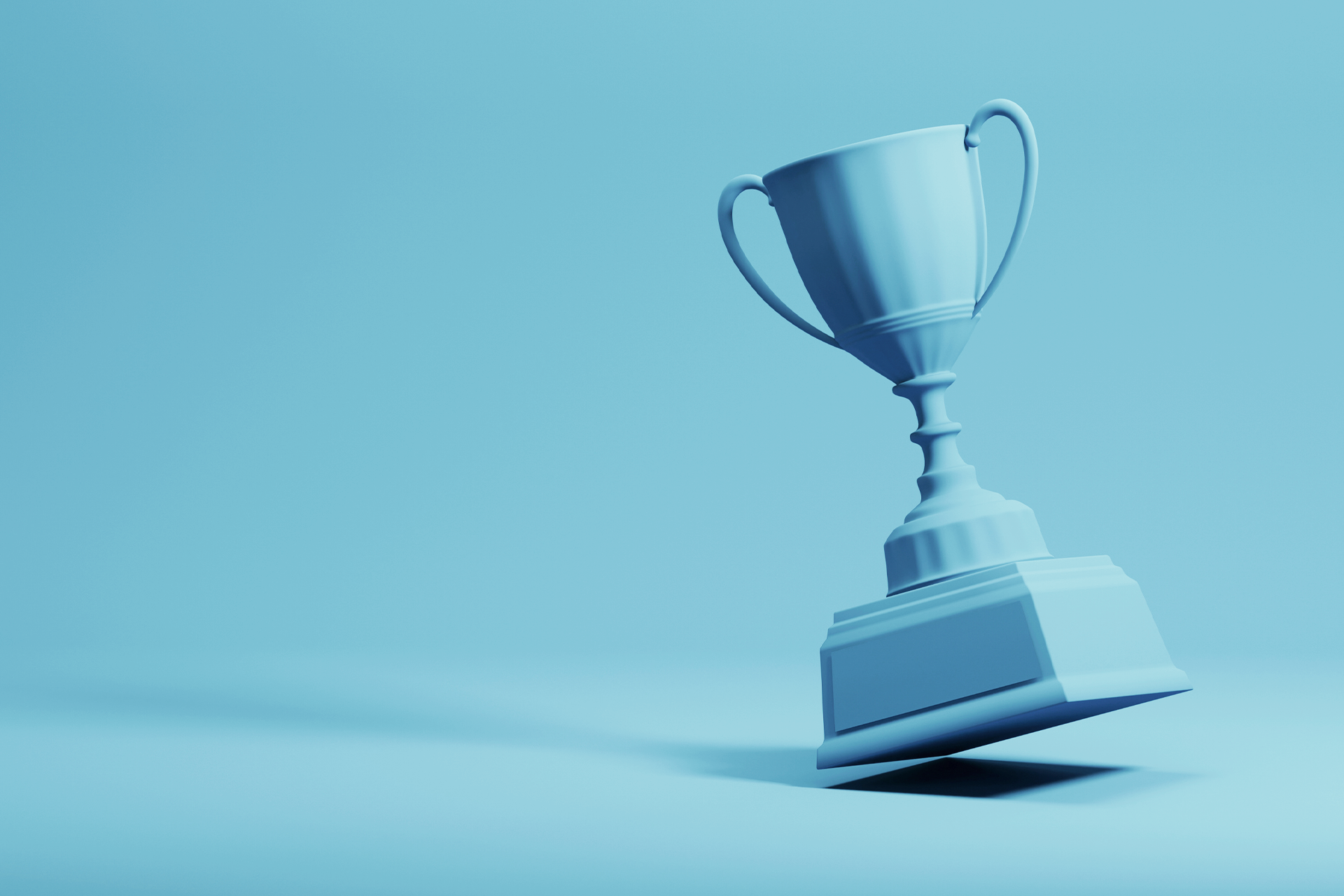 A blue trophy, like the one you might win if Facebook or Twitter gave out an award for the best social media marketing campaign, is set against a blue background. 