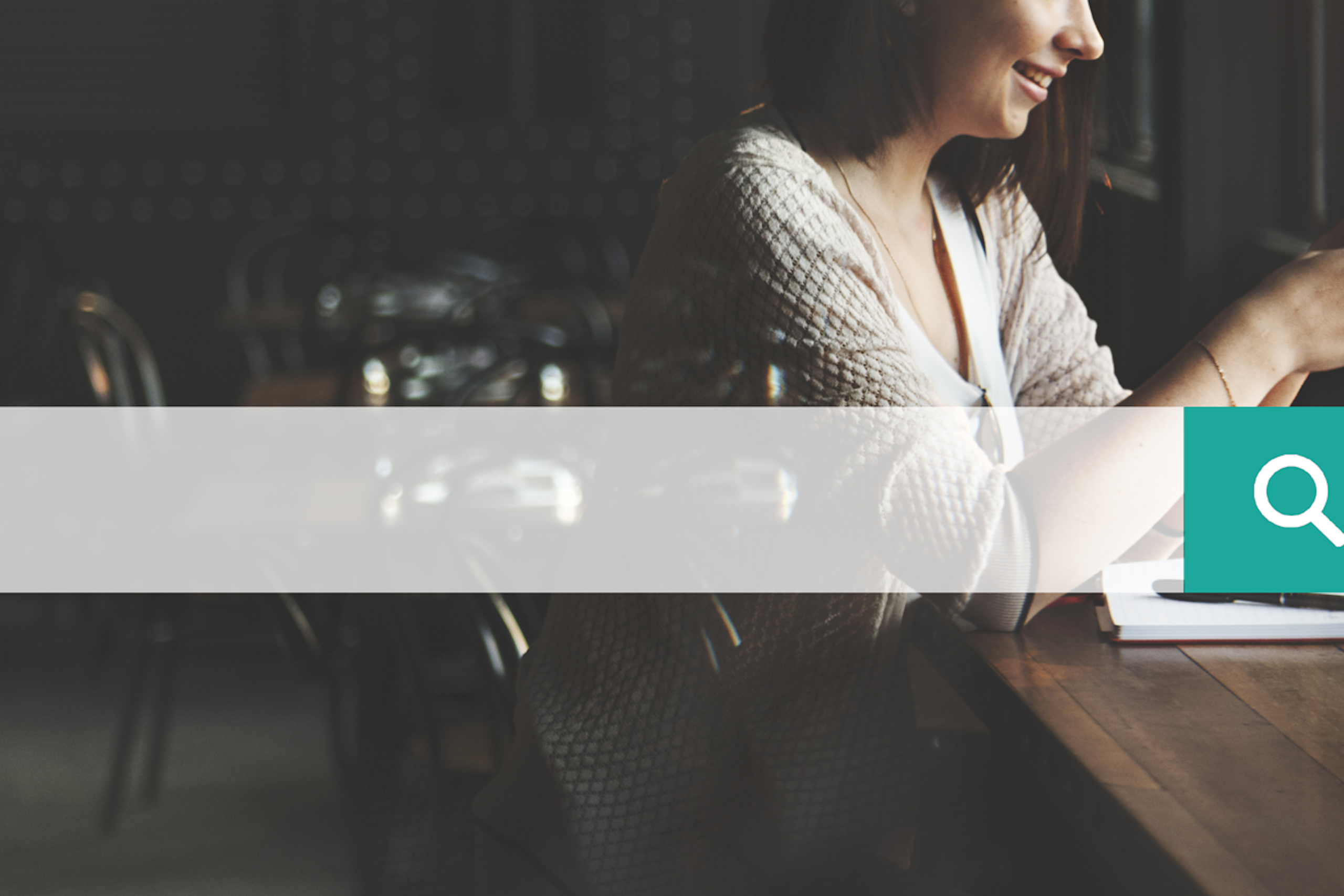 Foto of a woman sitting at a desk with a search bar overlay