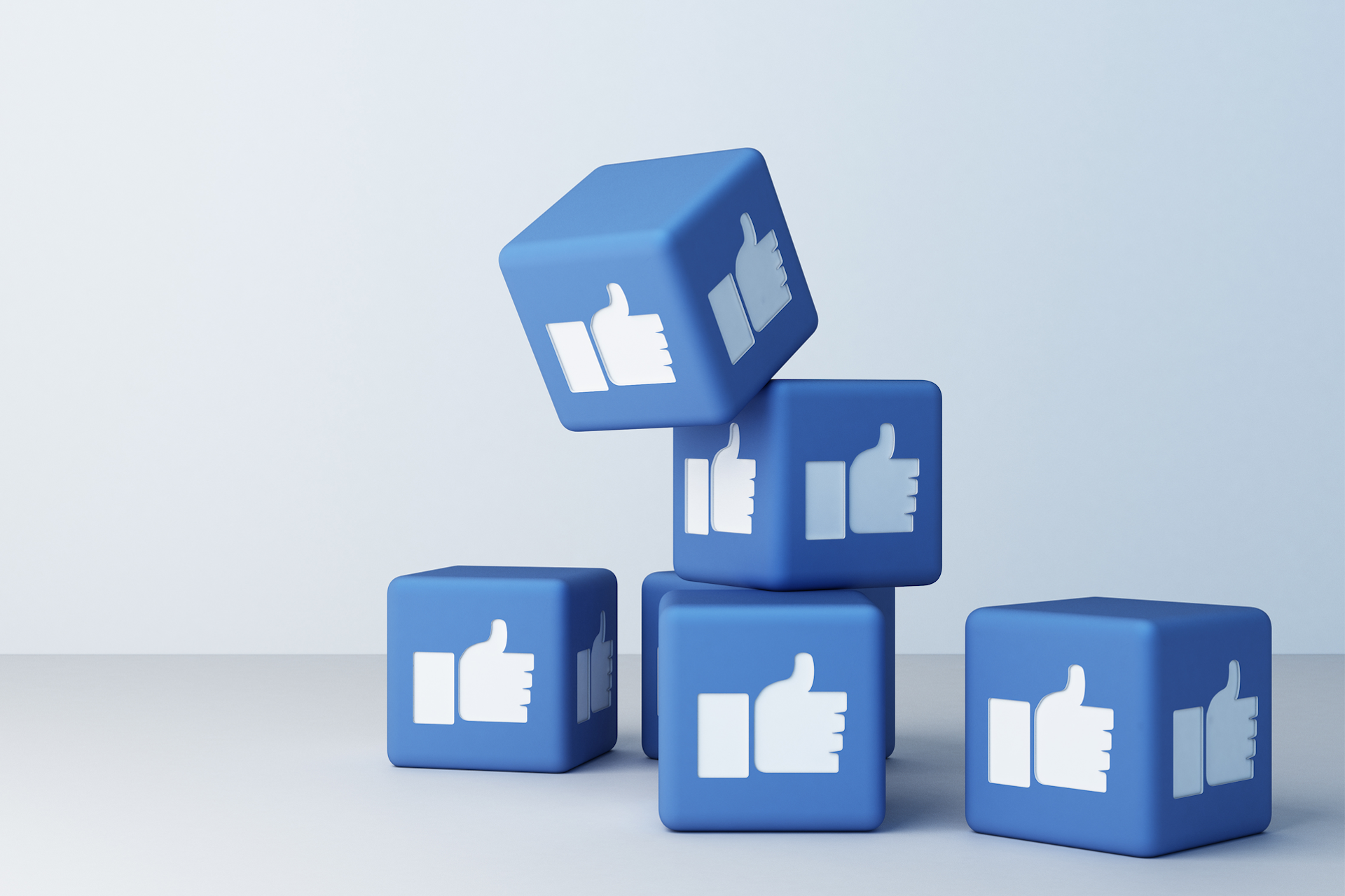 Blue cubes with the Facebook like button on the sides. 