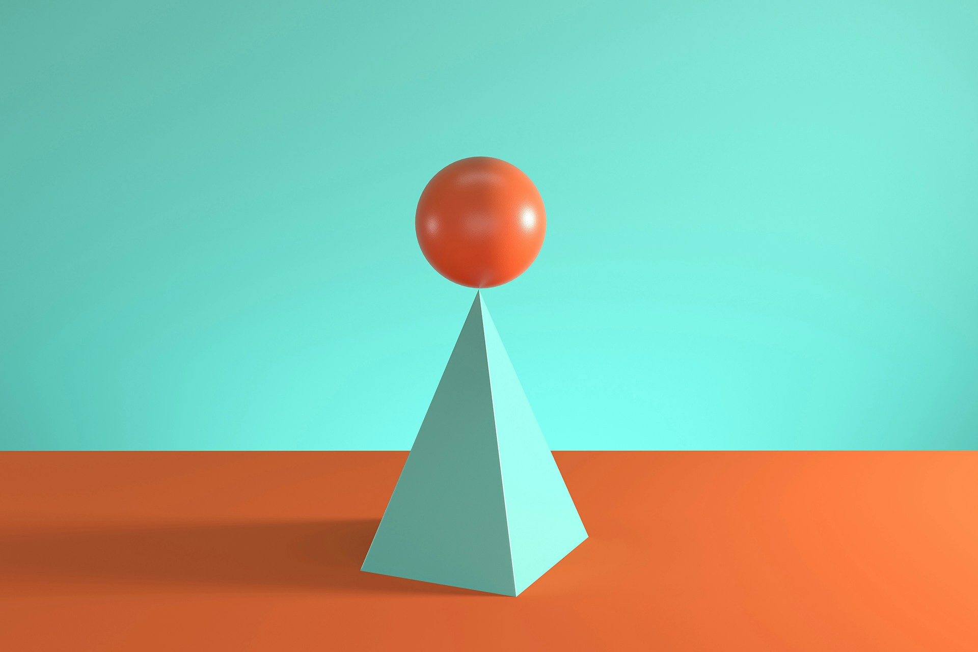 Building a brand strategy framework takes finesse and balance, which is why this image of an orange sphere balanced atop a teal prism is a fitting metaphor for the skill required in assembling a brand strategy. 