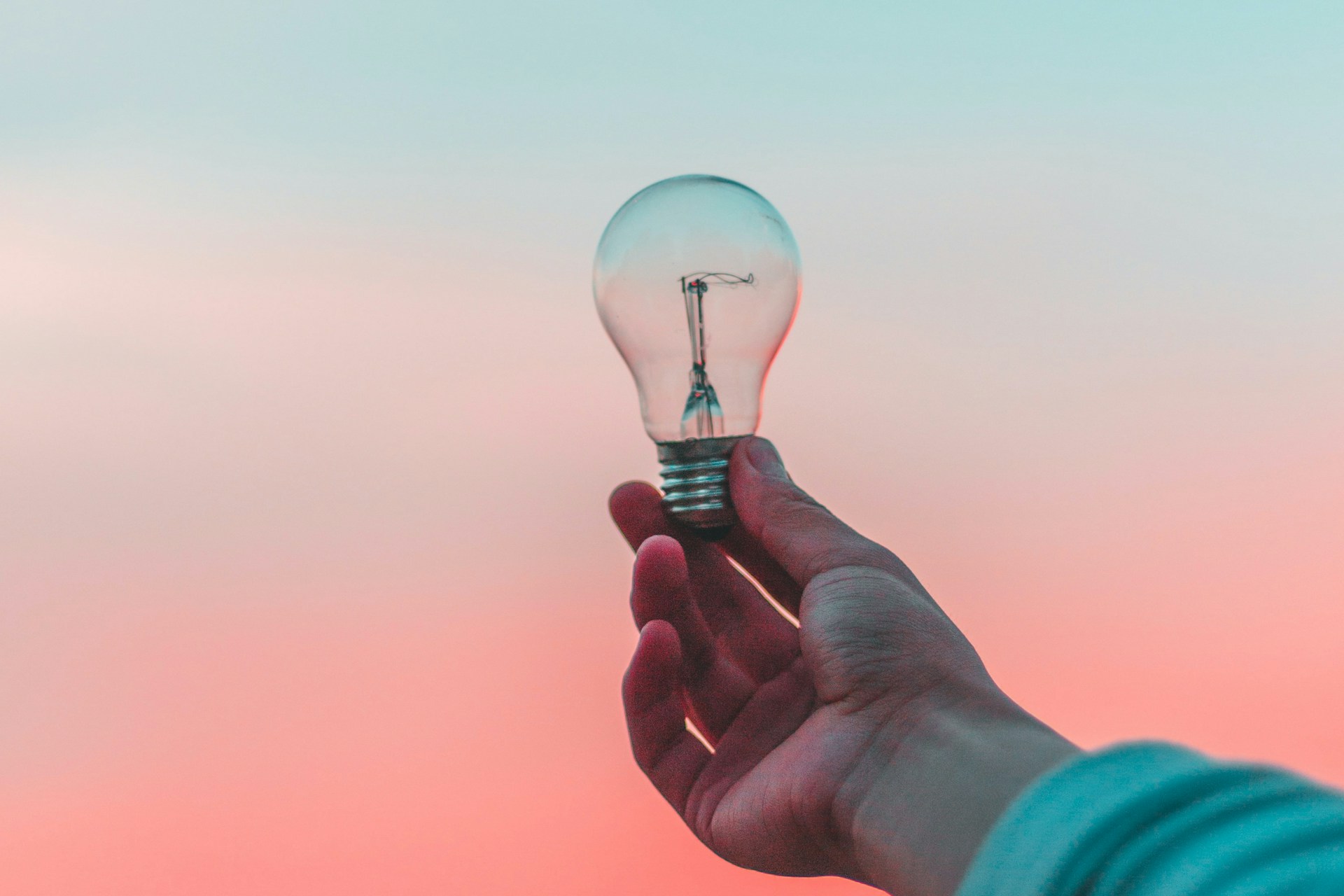 person holding a light bulb for innovation