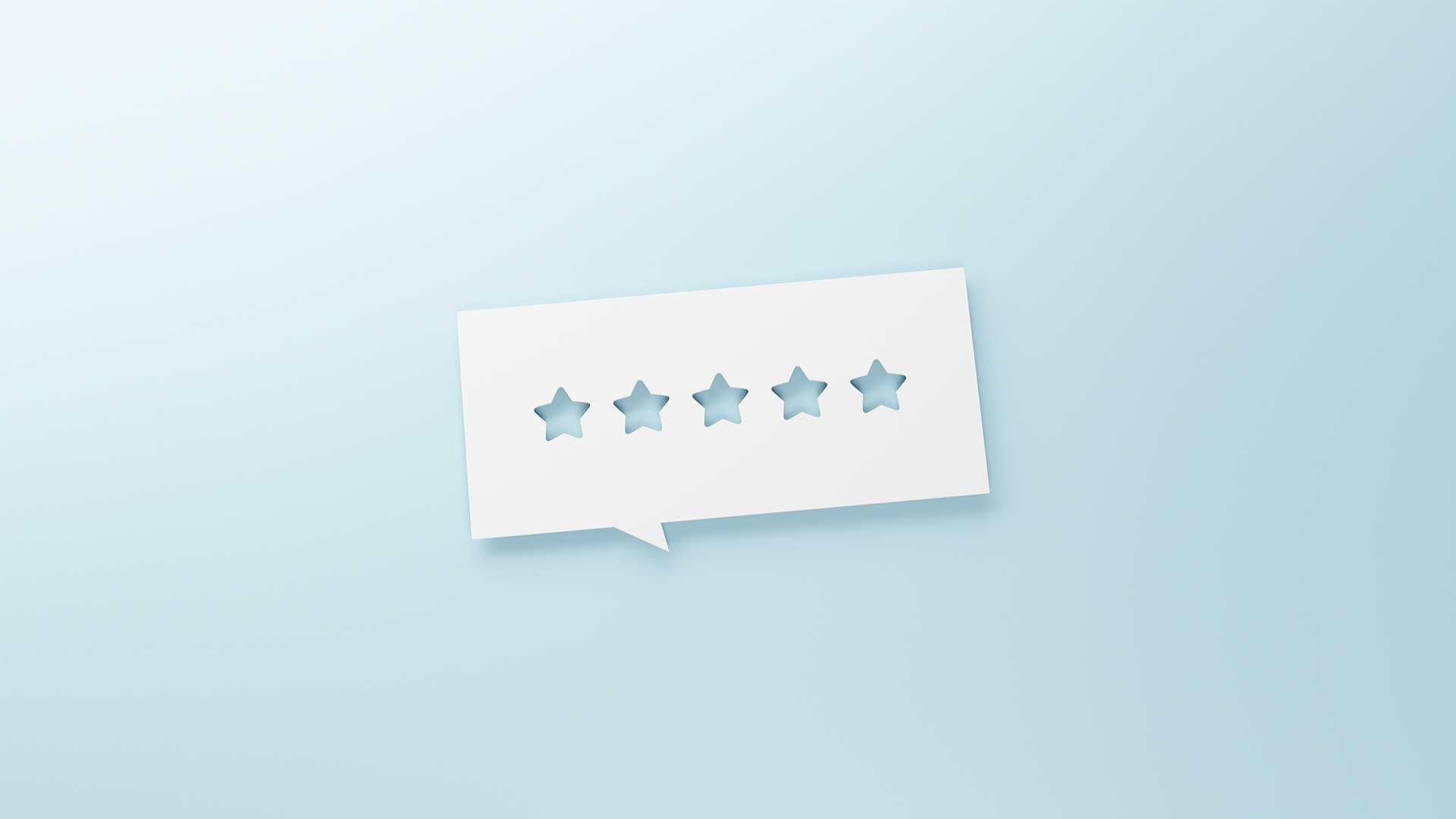 Ein Bild einer weißen Sprechblase mit fünf Sternen in der Mitte