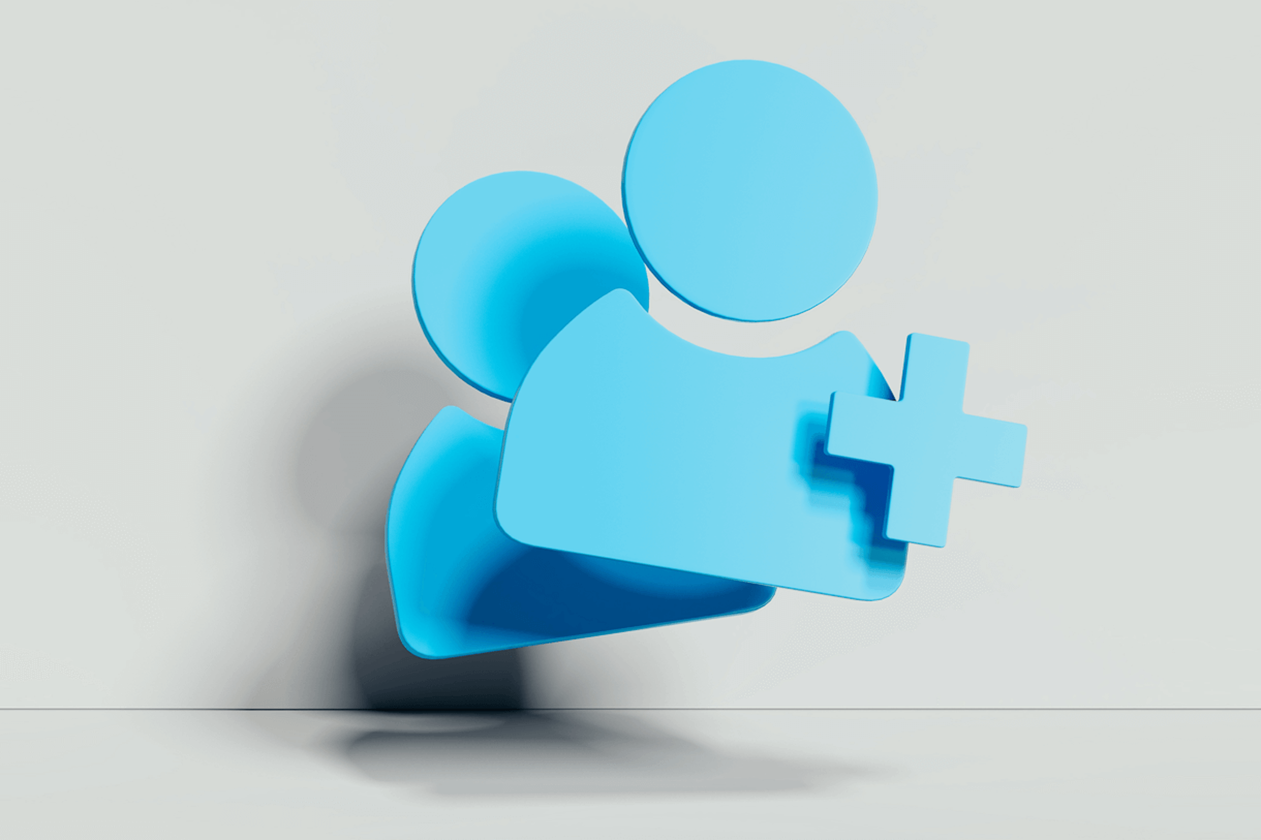 Illustration von zwei menschlichen Symbolen hinter einem blauen Pluszeichen. Blogbeitrag zu Marken-Communities