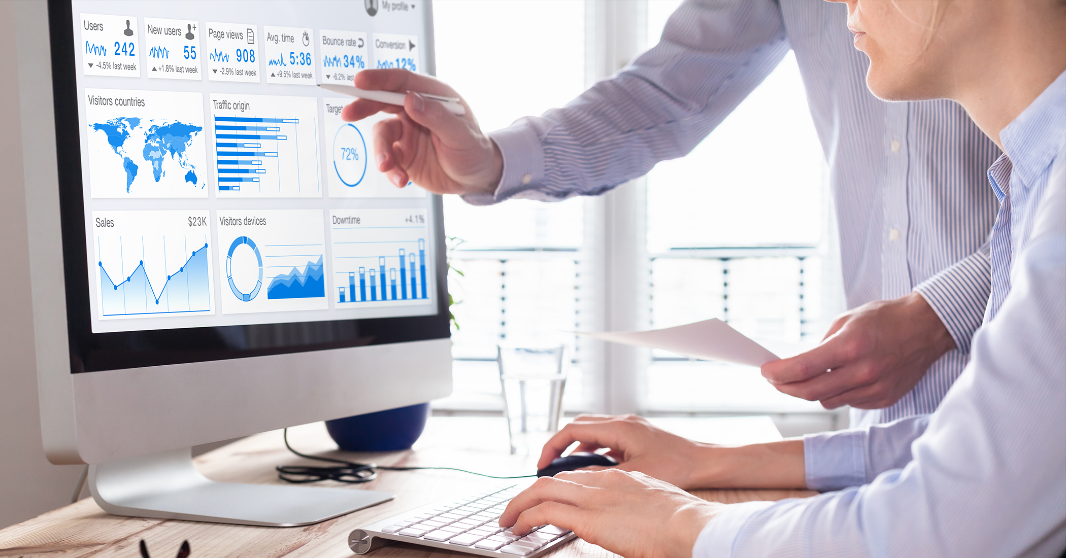 Webinar: People look at a dashboard on a monitor 