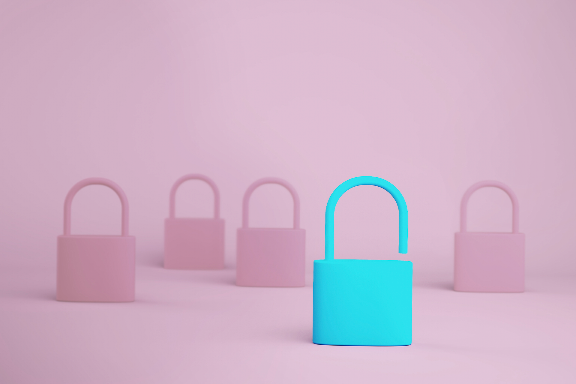 A teal padlock that is unlocked among a bunch of pink padlocks that are closed. 