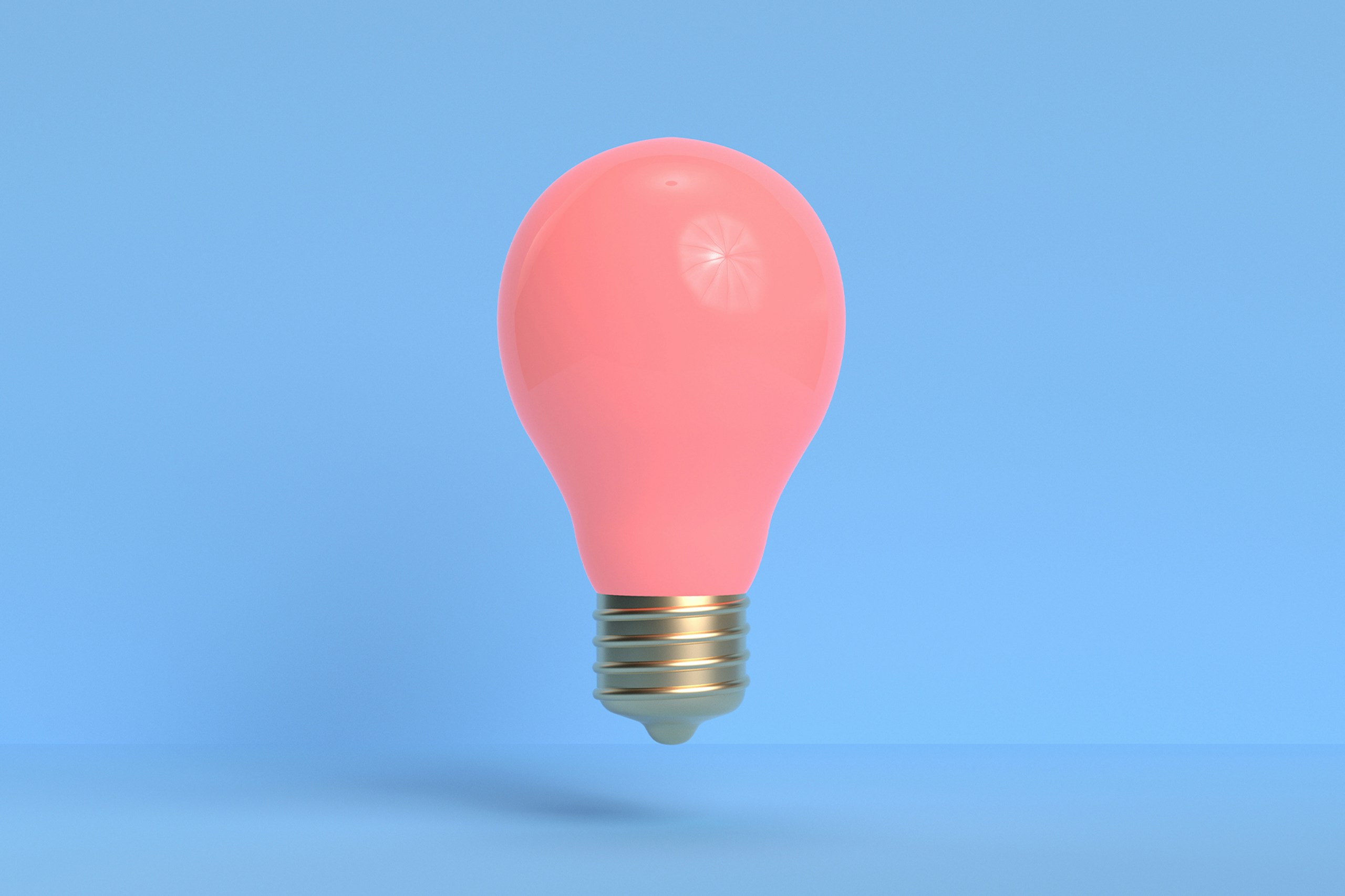 Ampoule rose sur fond bleu