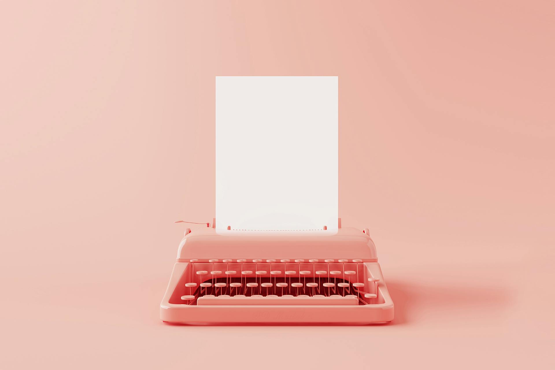 Pinkki kirjoituskone, jonka keskeltä tulee valkoinen tyhjä paperi.