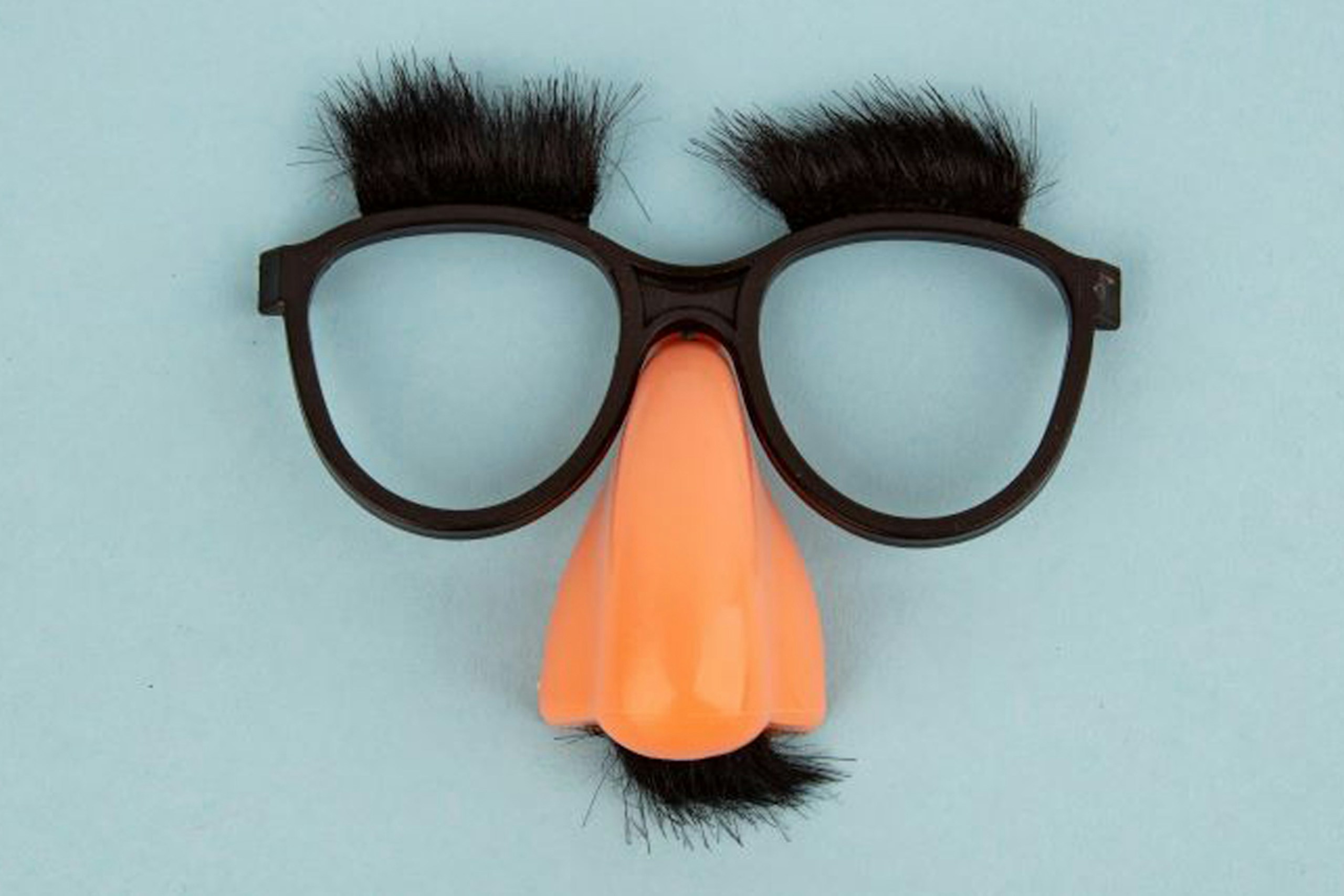 An image of a pair of Groucho Marx glasses, with a large nose, large eyebrows, and mustache
