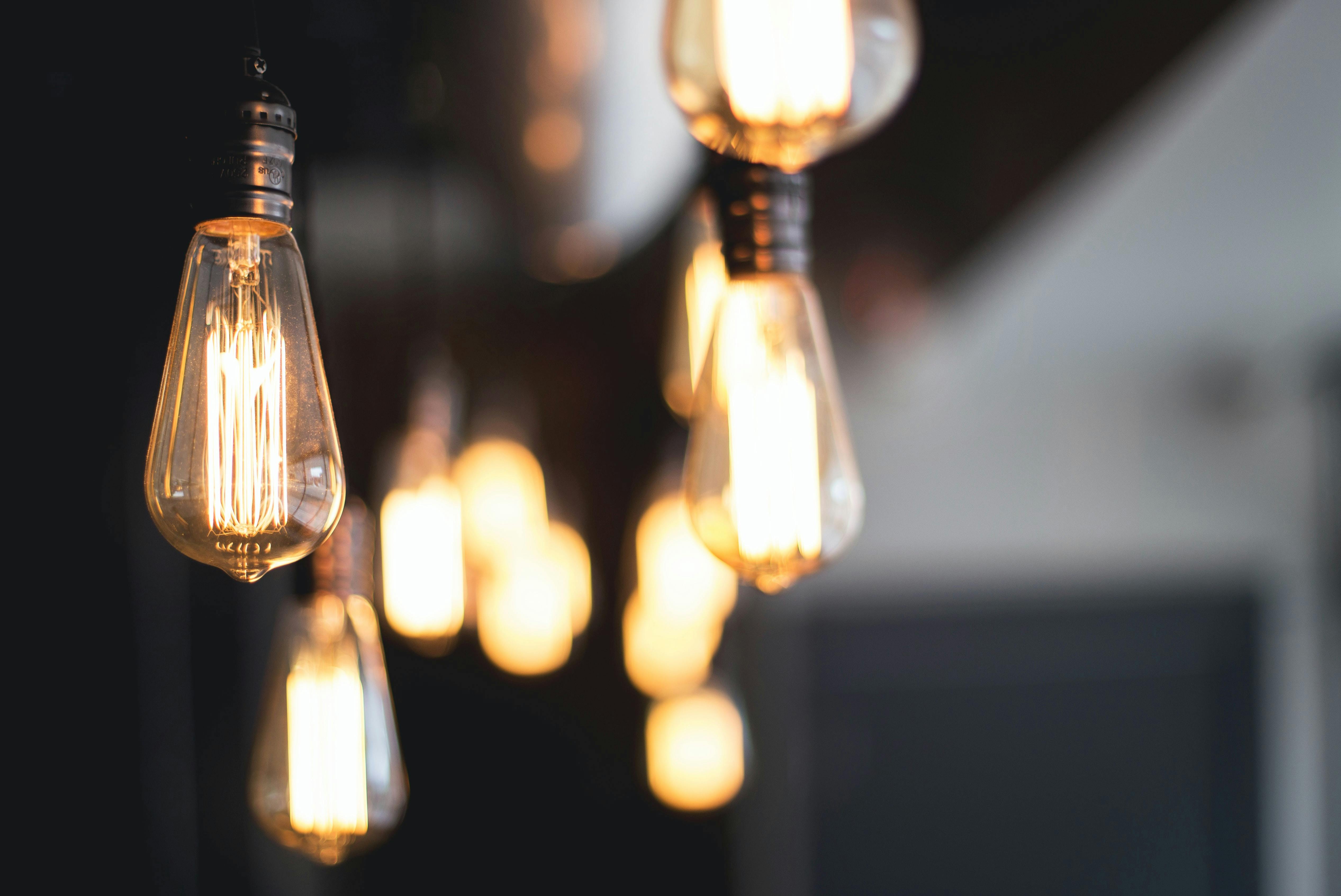Old fashioned lights hanging from the ceiling. Lighting is a key component to professional video marketing