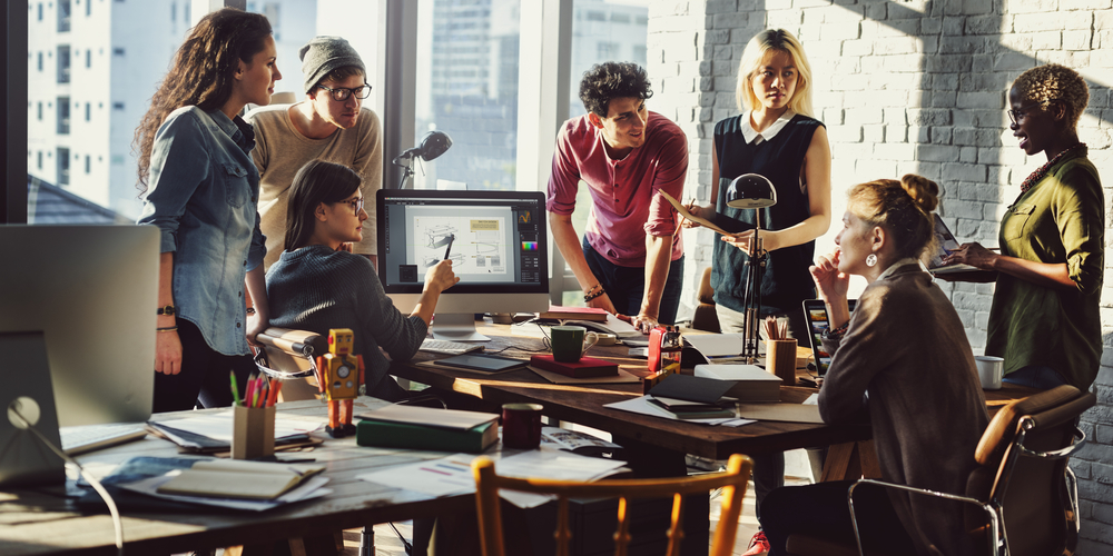 Photo of a team working together in an office