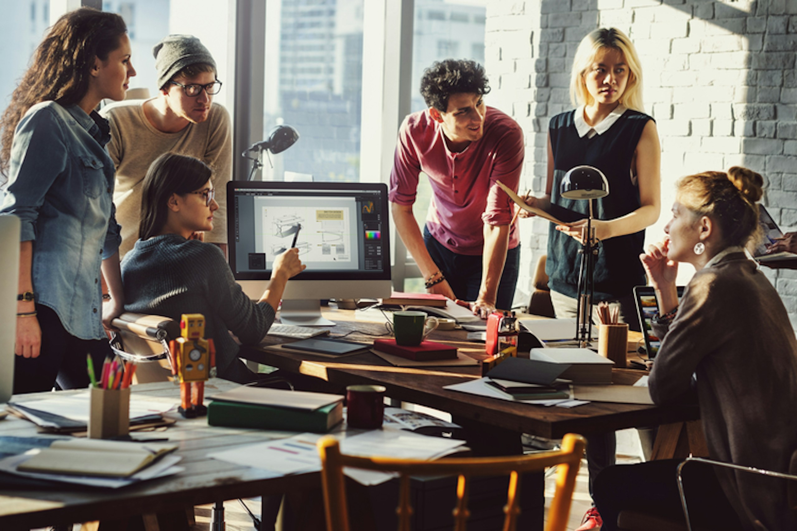 Photo of a team working together in an office
