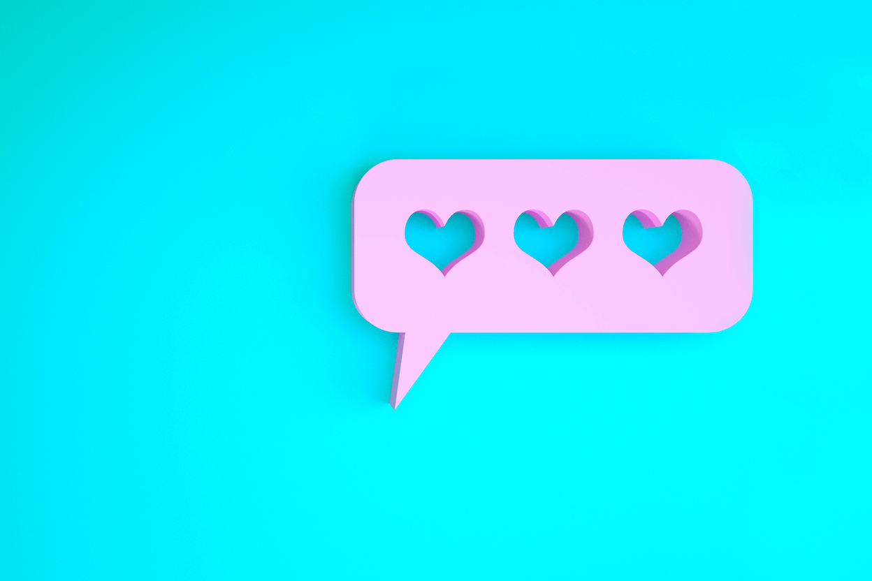 A purple conversation bubble with three hearts cut into it that resembles the icon that appears when you get a "like" on your Instagram business account