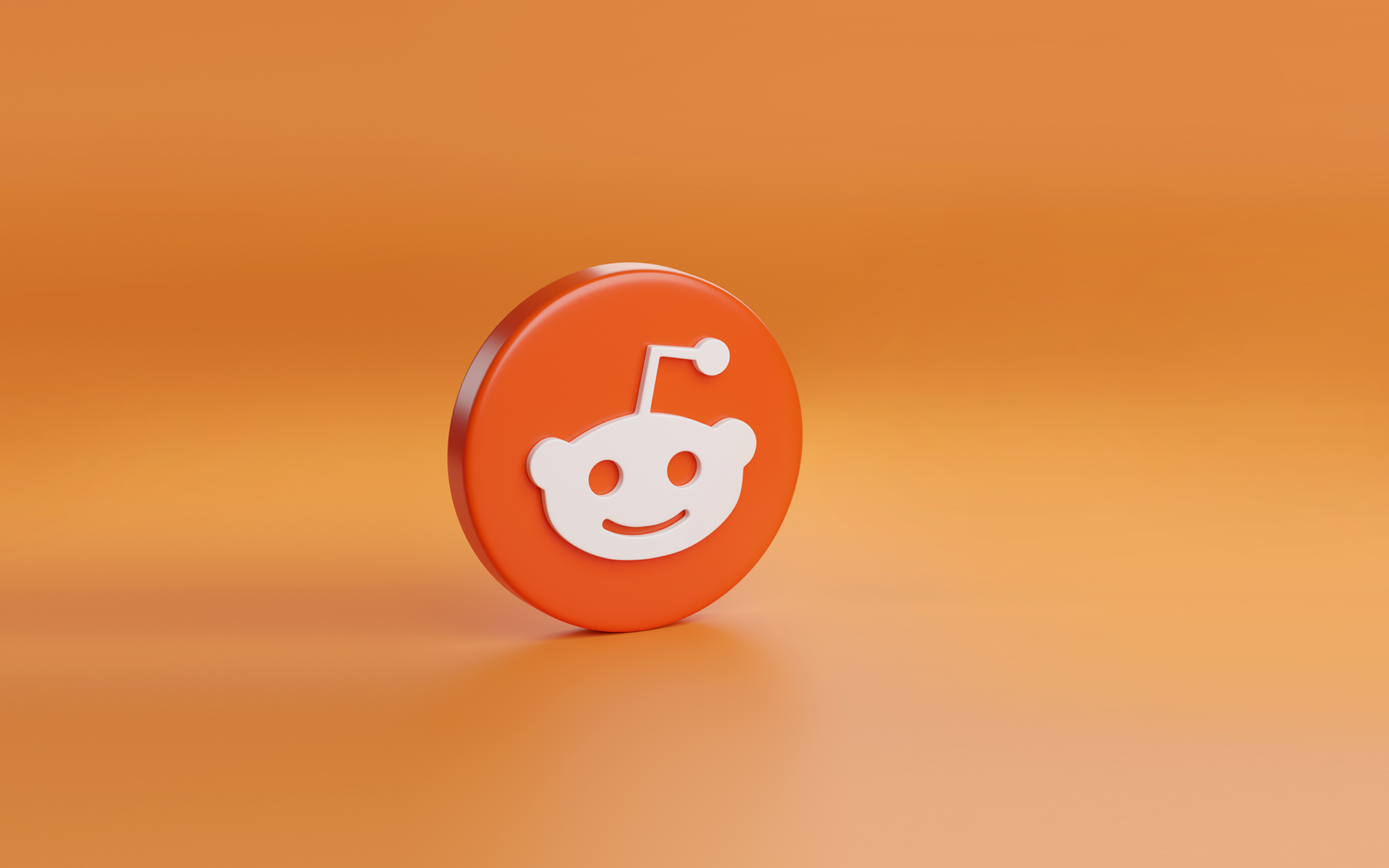 The Reddit logo against an orange background for a blog about brands marketing on Reddit.