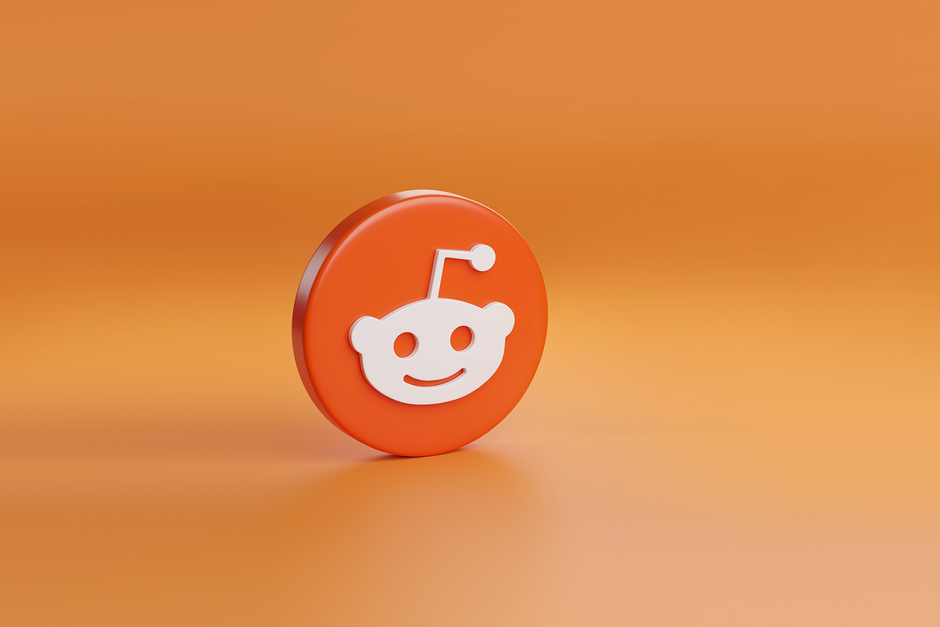 The Reddit logo against an orange background for a blog about brands marketing on Reddit.