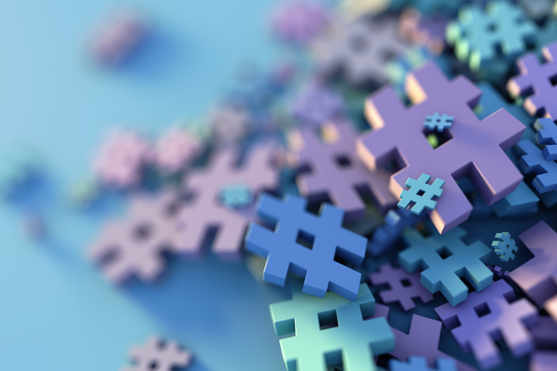 An illustration showing a pile of hashtags in various colors. Blog image for Trendjacking