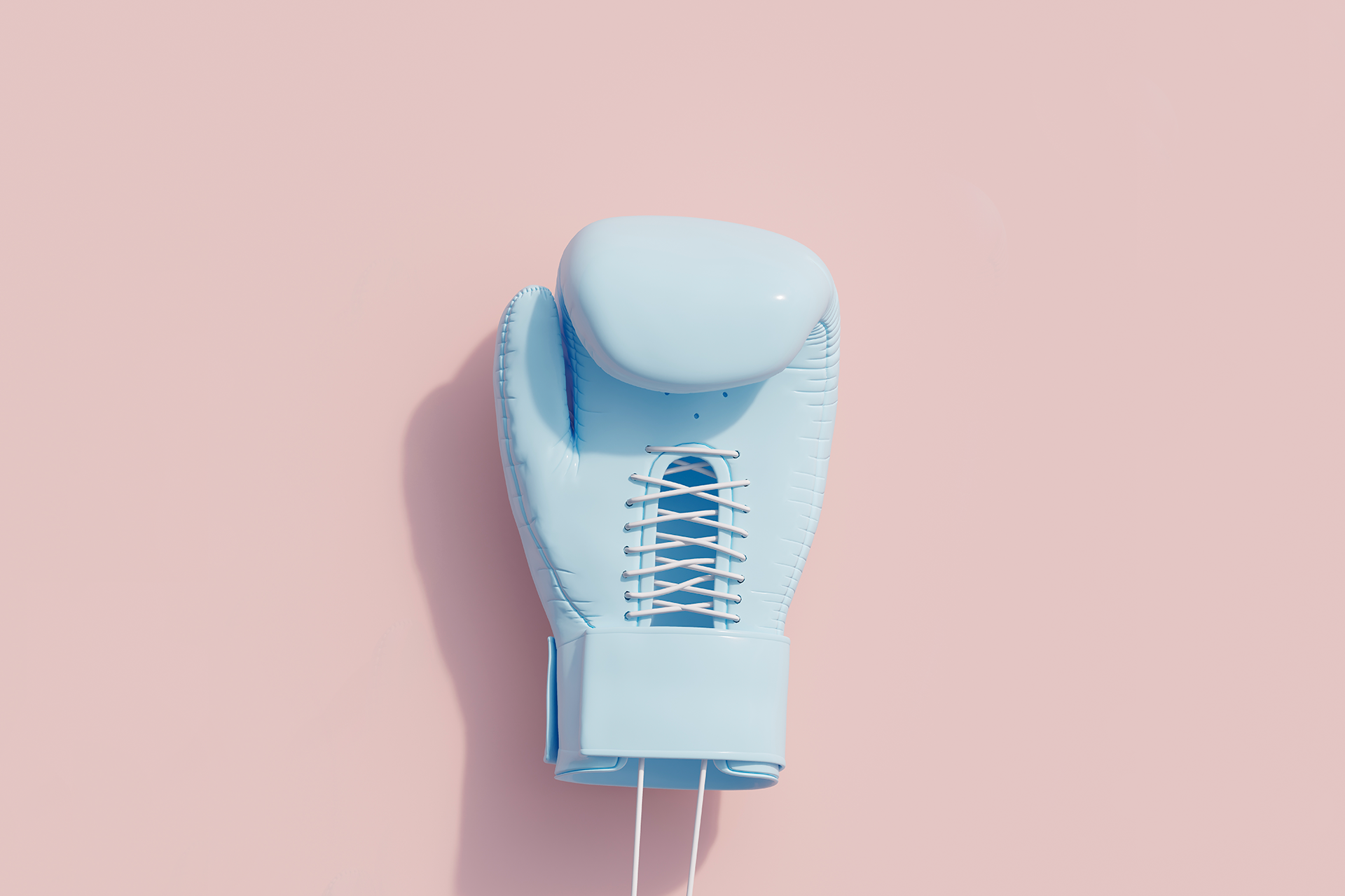 A blue boxing glove against a solid pink background. This guide will help you understand the concept of Competitive intelligence and how CI can benefit your business so you can fight off the competition.