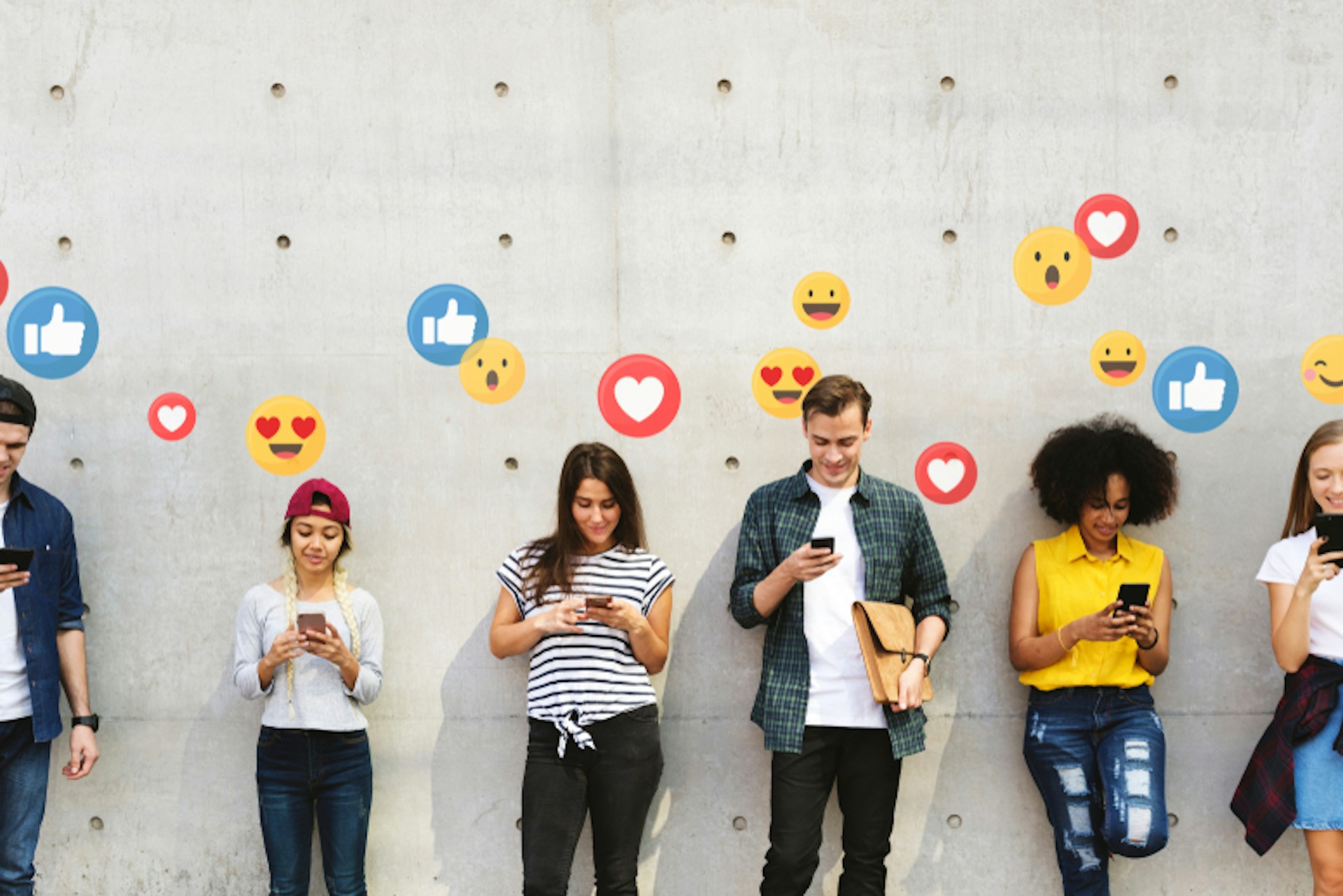 People using smartphones lined up against a wall. Facebook reactions are illustrated above them