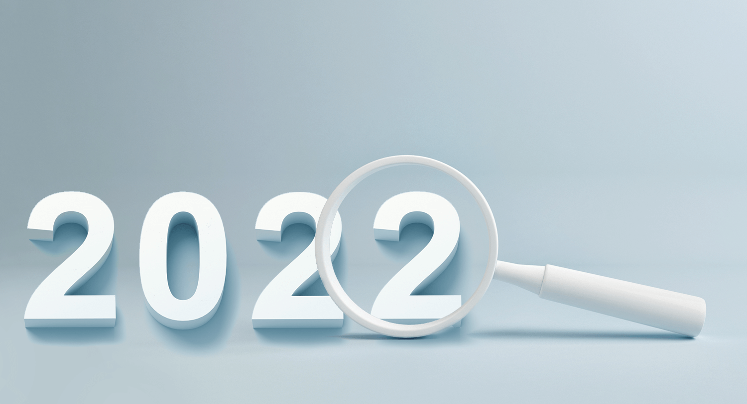 A magnifying glass hovers over the last 2 in 2022, for a blog about the top trends of the year as analyzed by Meltwater's social intelligence platform.