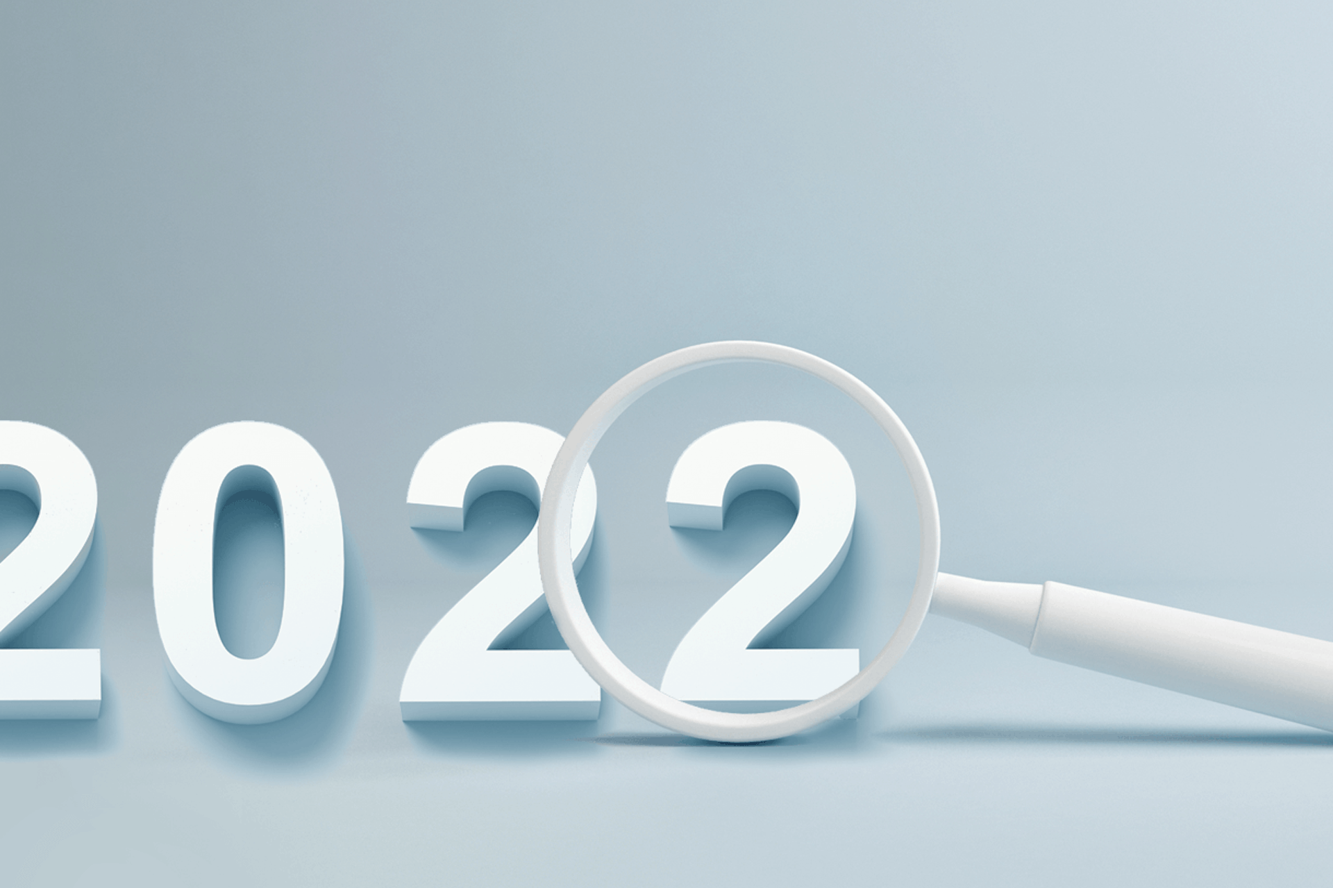A magnifying glass hovers over the last 2 in 2022, for a blog about the top trends of the year as analyzed by Meltwater's social intelligence platform.