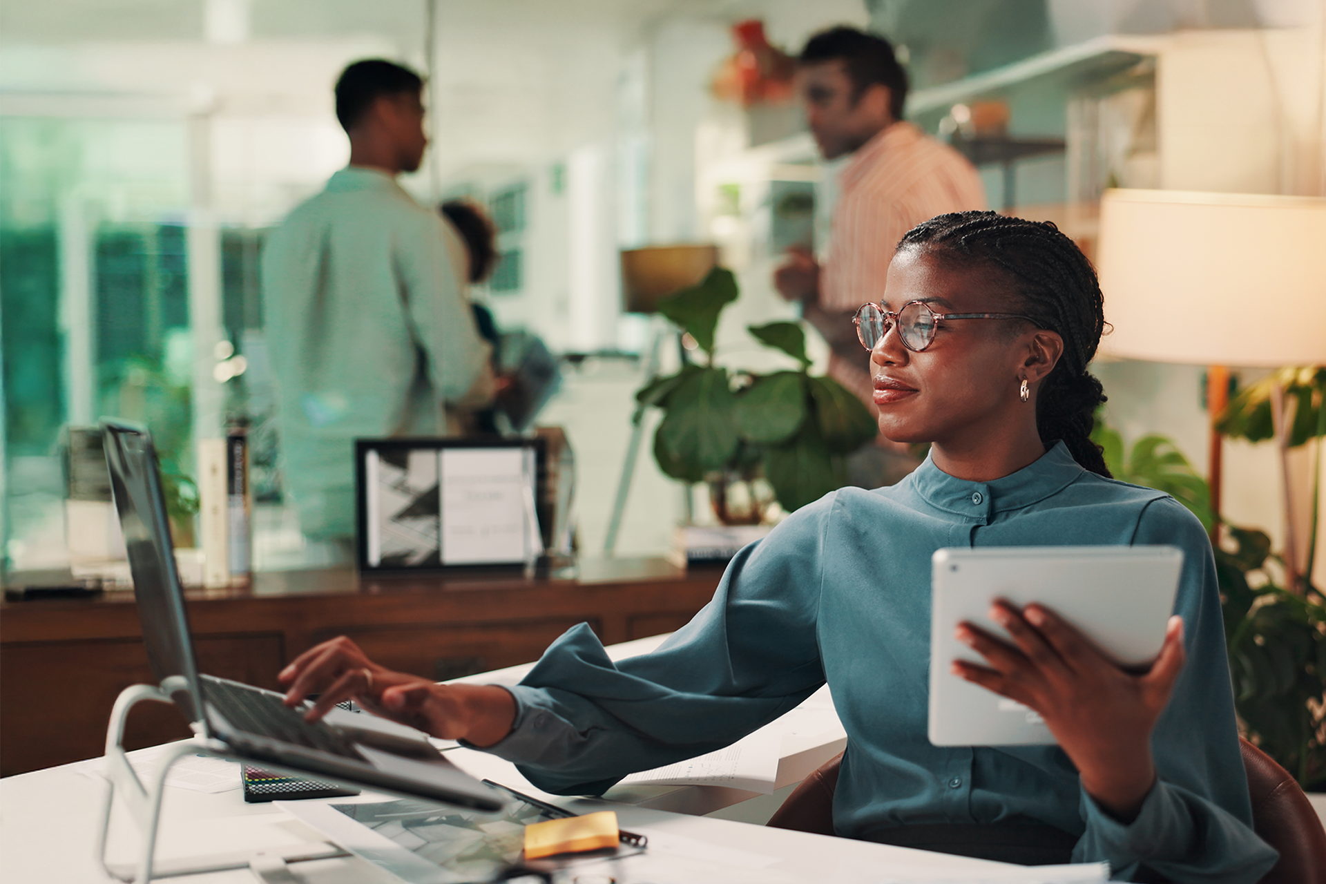 An office worker operating a laptop computer. 