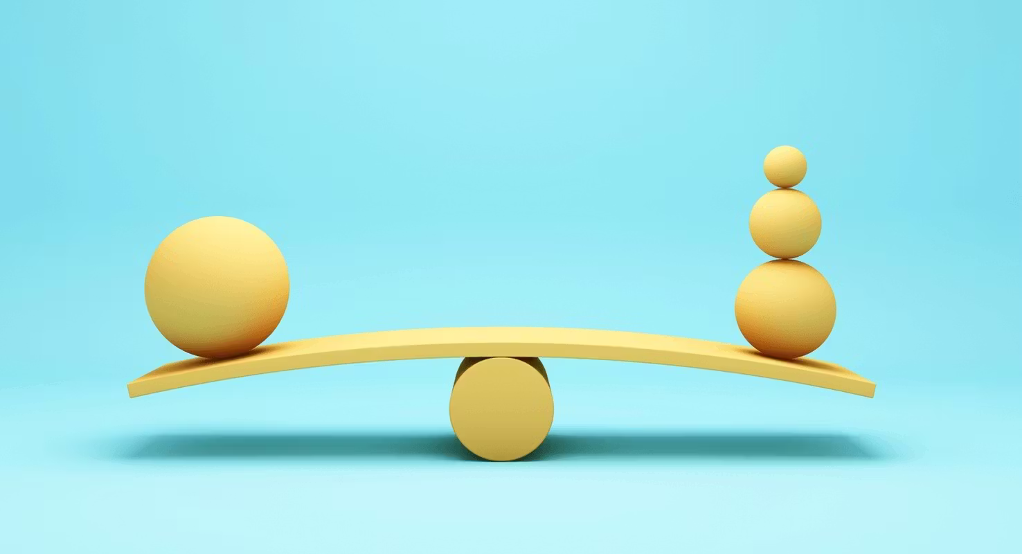 A seesaw with wooden blocks balanced on either side