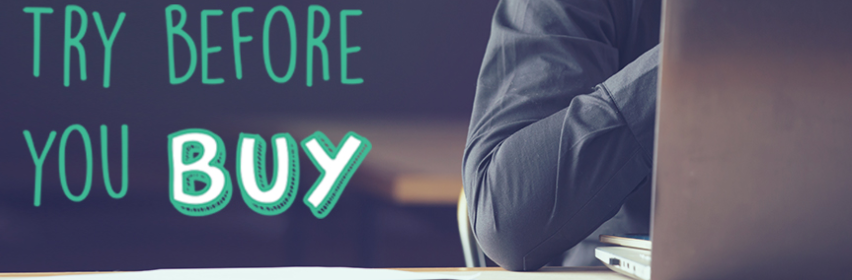 A man sitting behind a computer screen