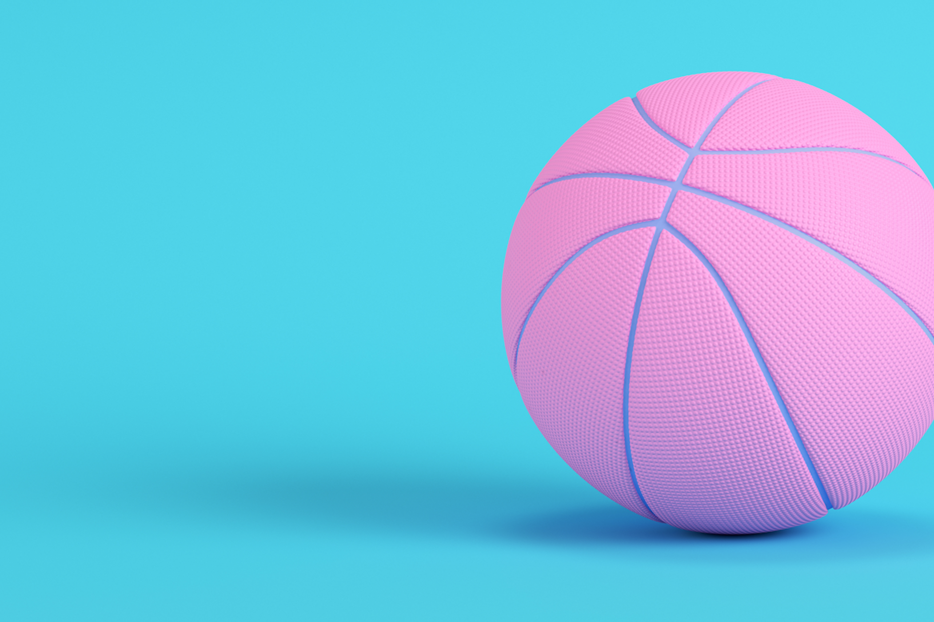 A pink basketball against a blue background for a blog about social listening and March Madness.