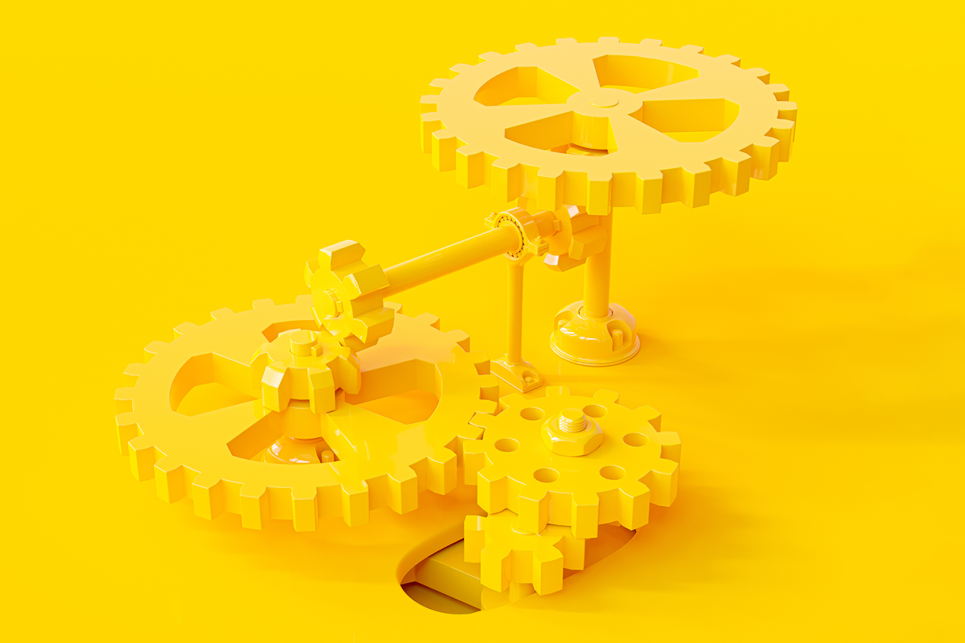 Image showing yellow cogs and gears on a bright yellow background. Industry 4.0 guide.