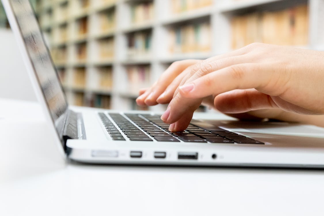 hands working on laptop