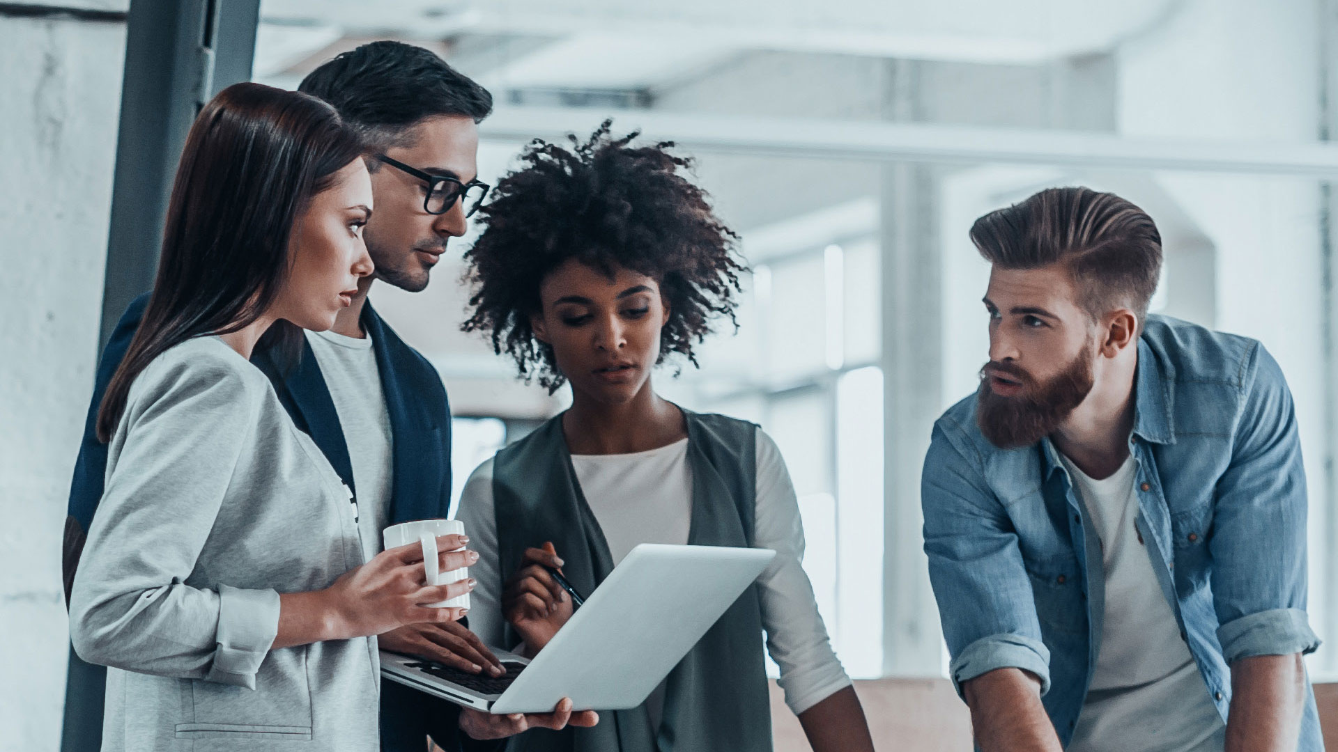 Photo of a team in an office working together
