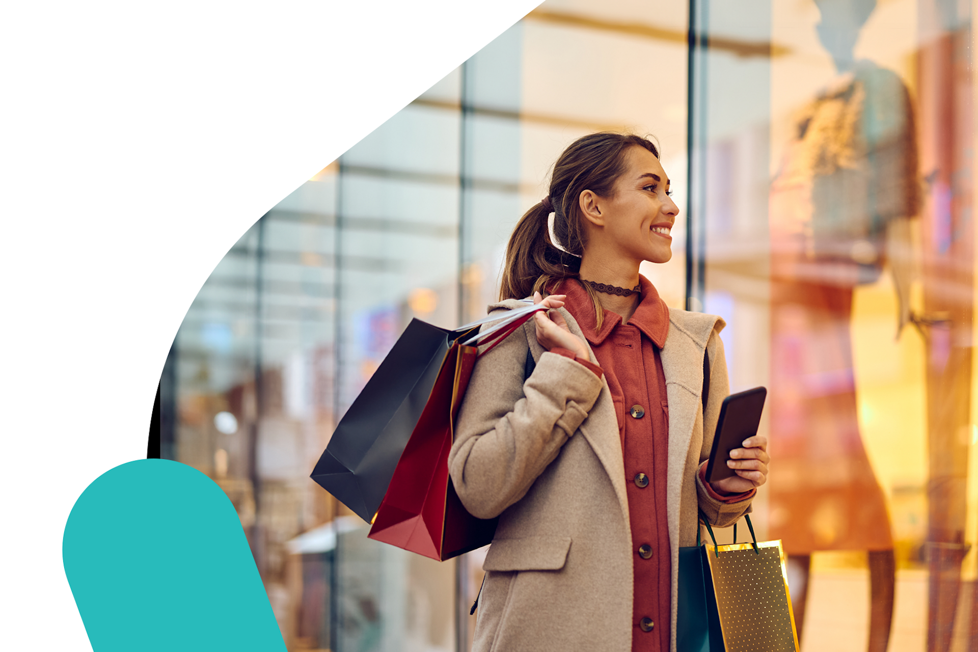 A person holding shopping bags and a mobile phone while window shopping in this image for Meltwater's 2024 Retail Report.