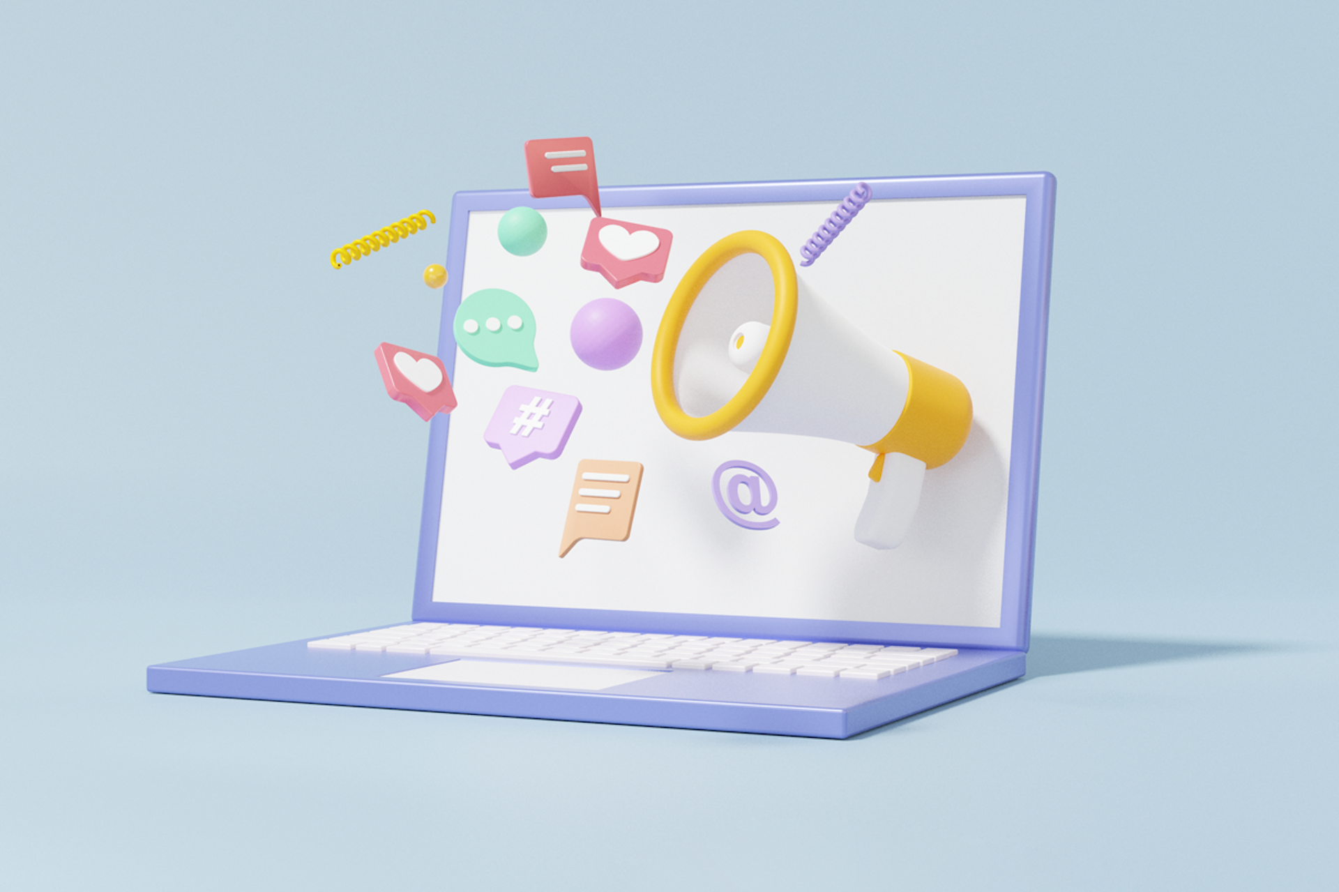 A megaphone and notification symbols pop out of a laptop screen in this image for a blog about user-generated content examples.