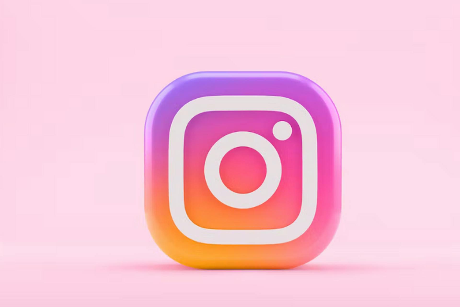 Logo Instagram sur fond rose