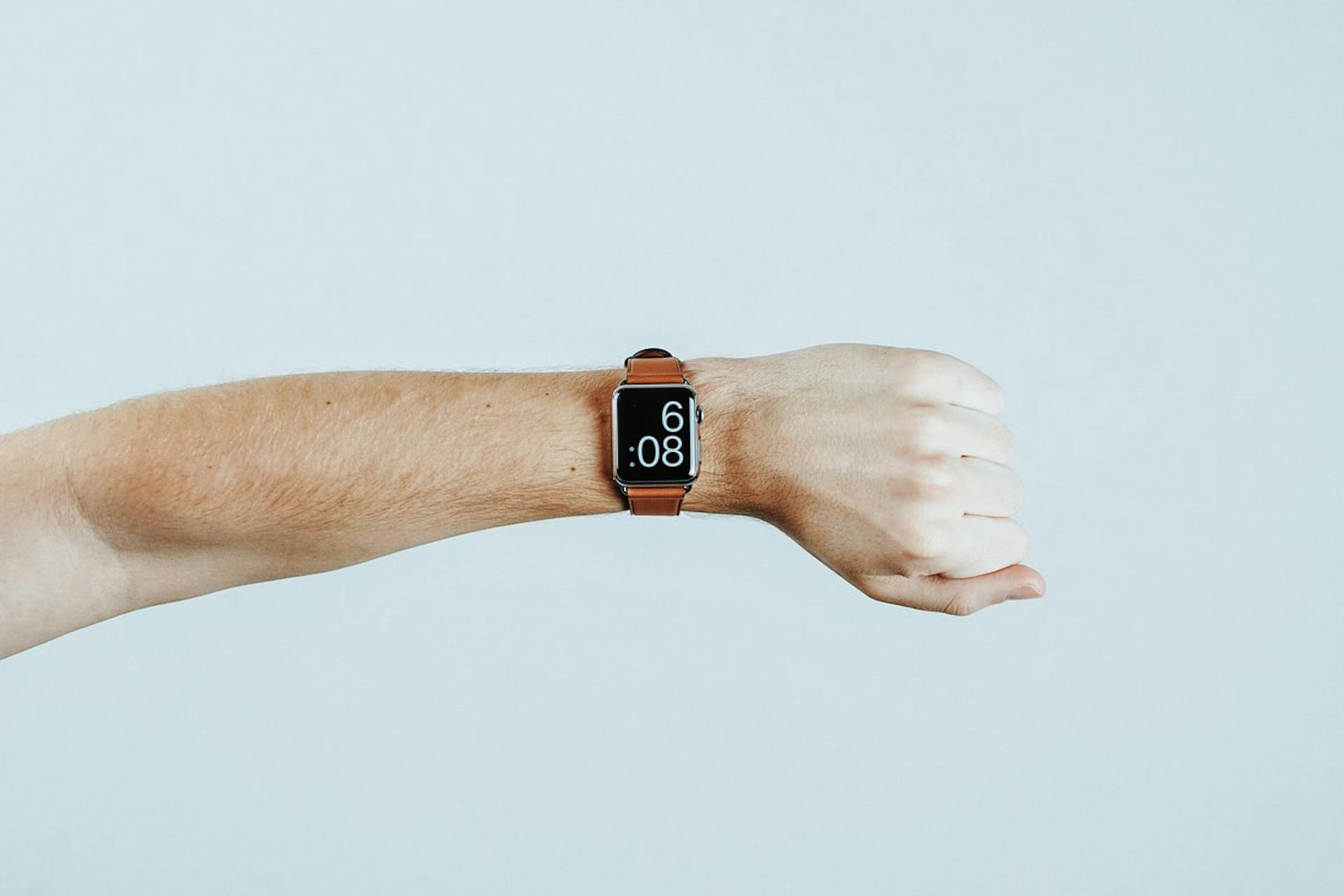 best date and time man looking at his digital watch