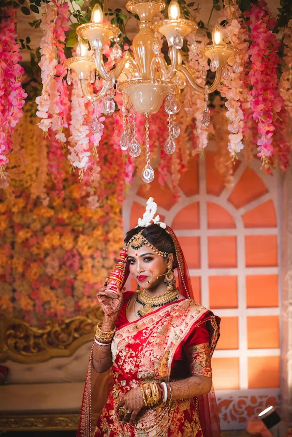Bride posing in her lavish wedding saree