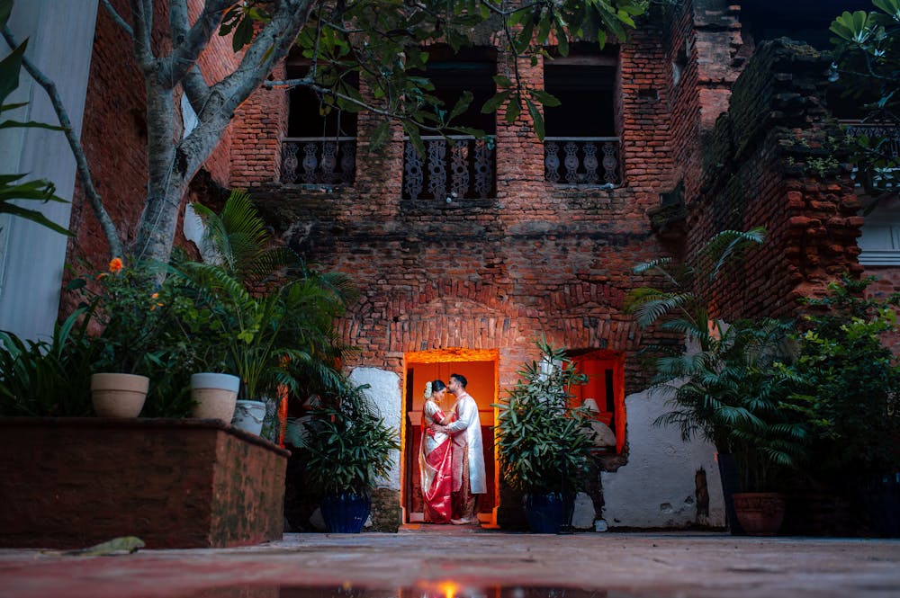 Groom kissing the forehead of bride pic