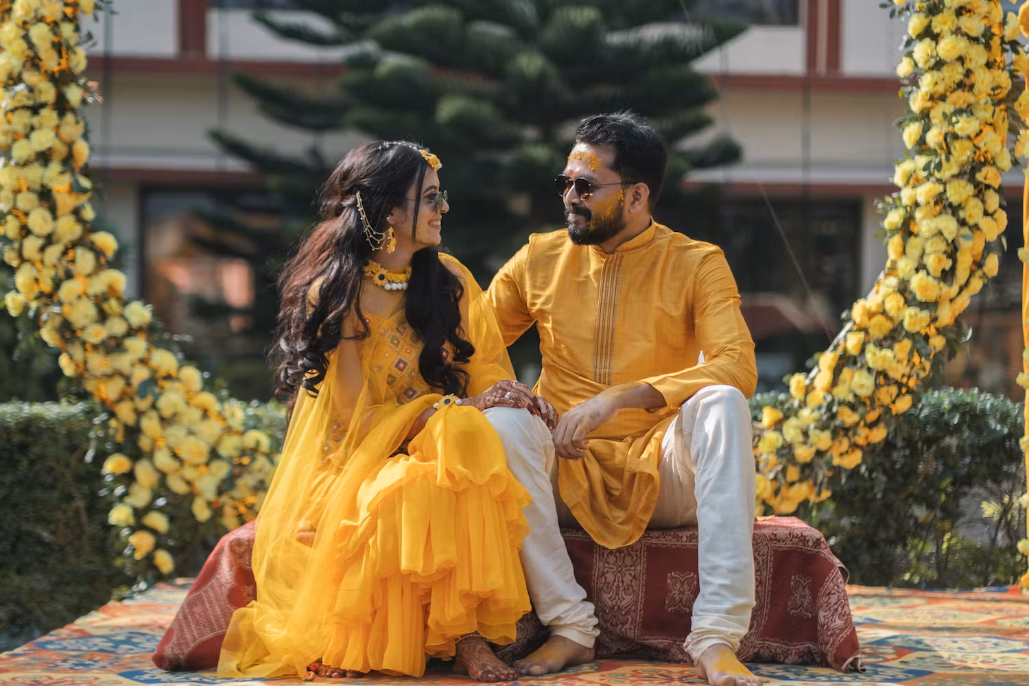 Couple posing for their Haldi picture