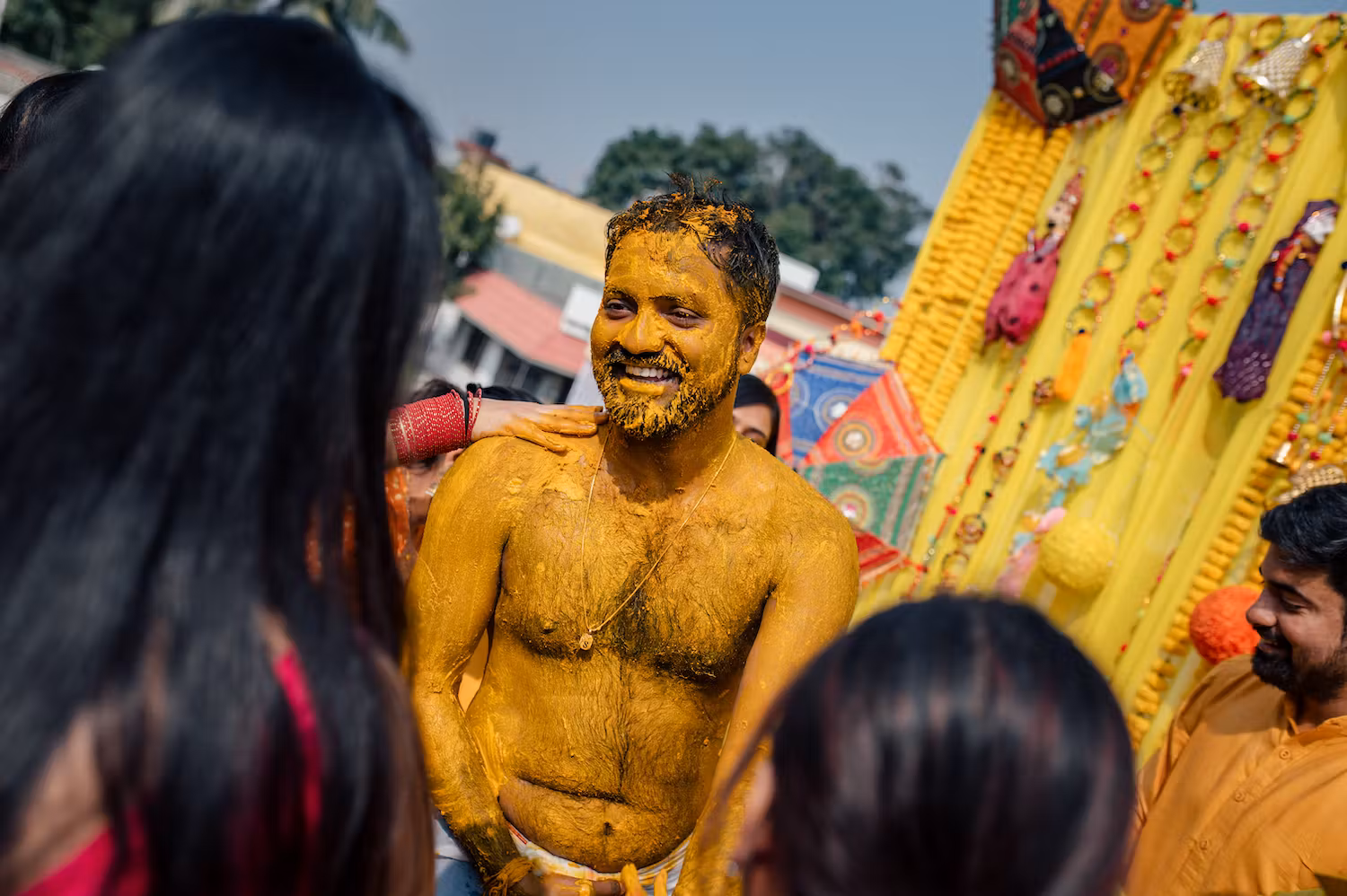 A groom totally smeared in Haldi on his Haldi day