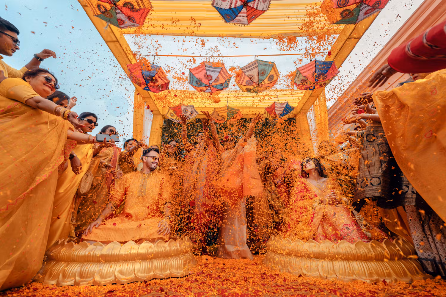 Groom and bride Haldi pose with family