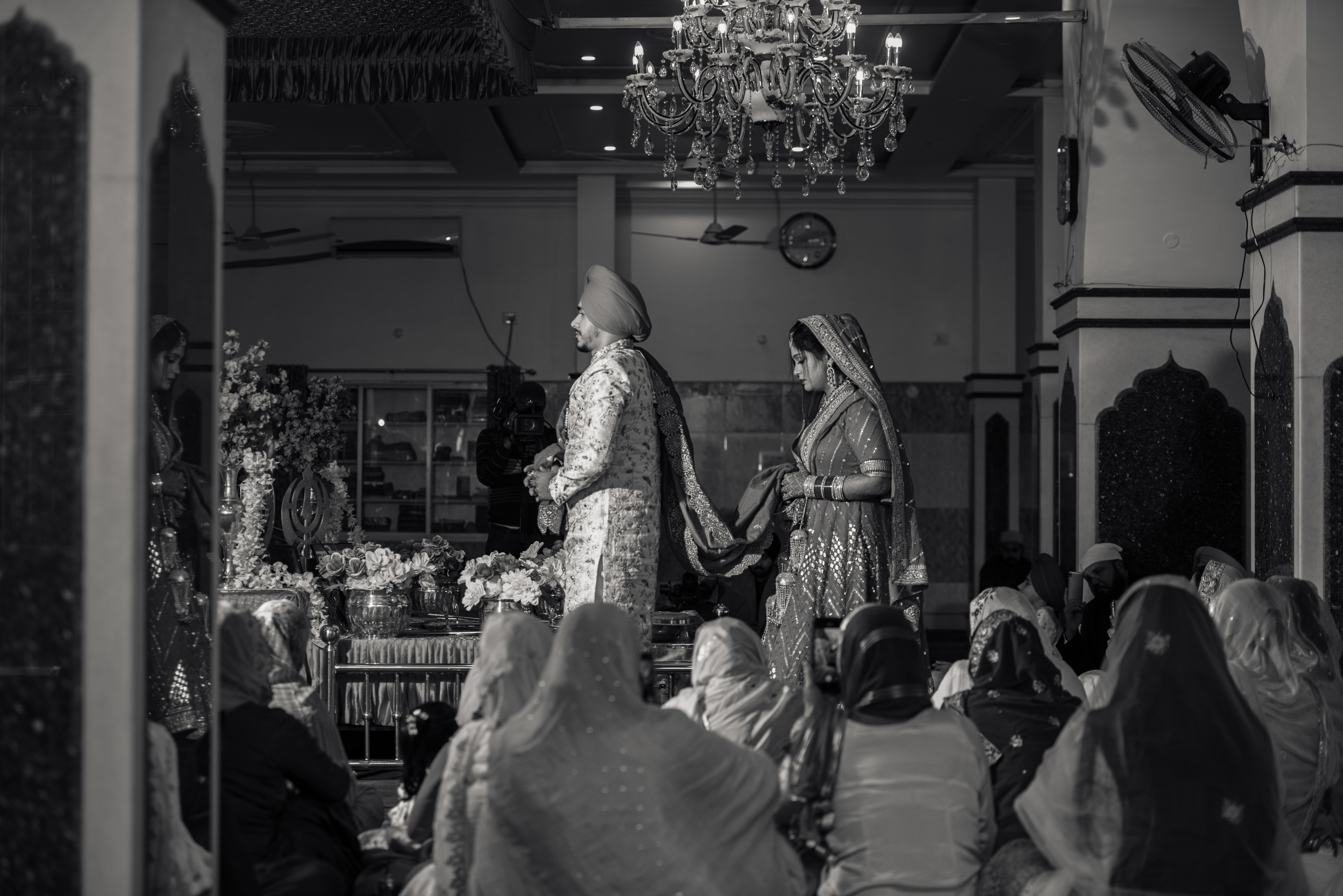 Sikh couple taking marriage vows pic