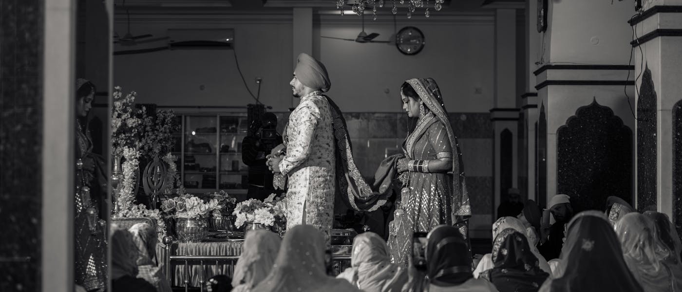 Sikh couple taking marriage vows pic