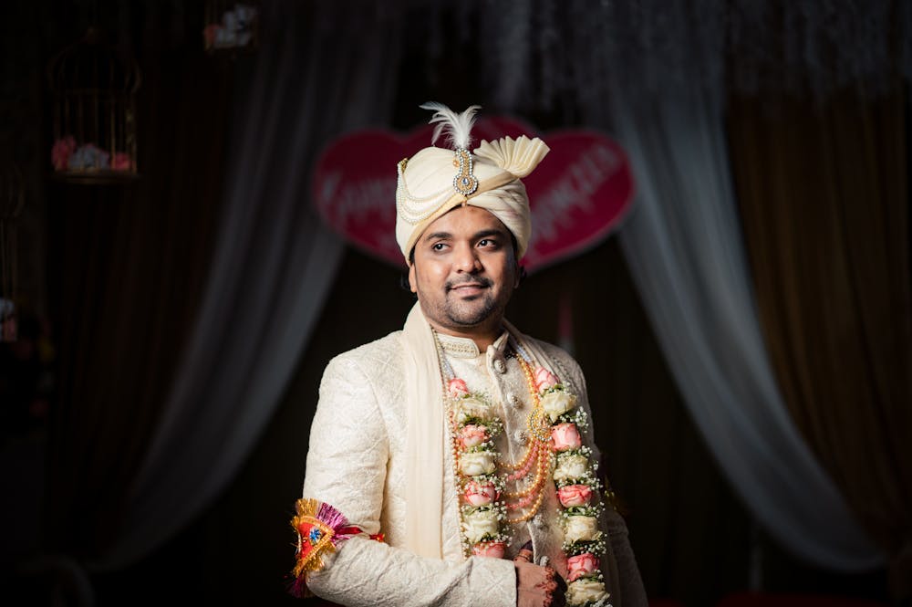 A portrait image of groom getting ready before wedding ceremony pic