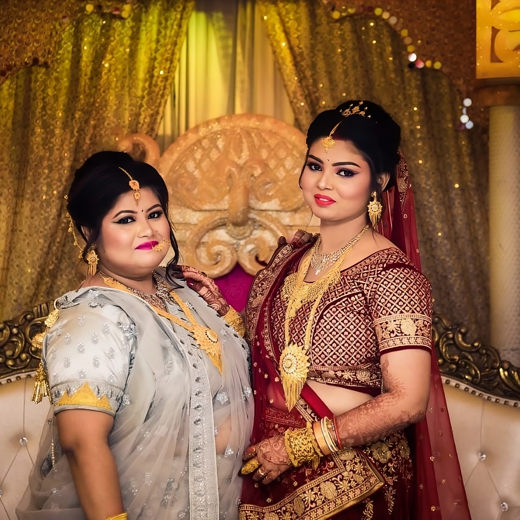 Bride posing with her main bridesmaid sister