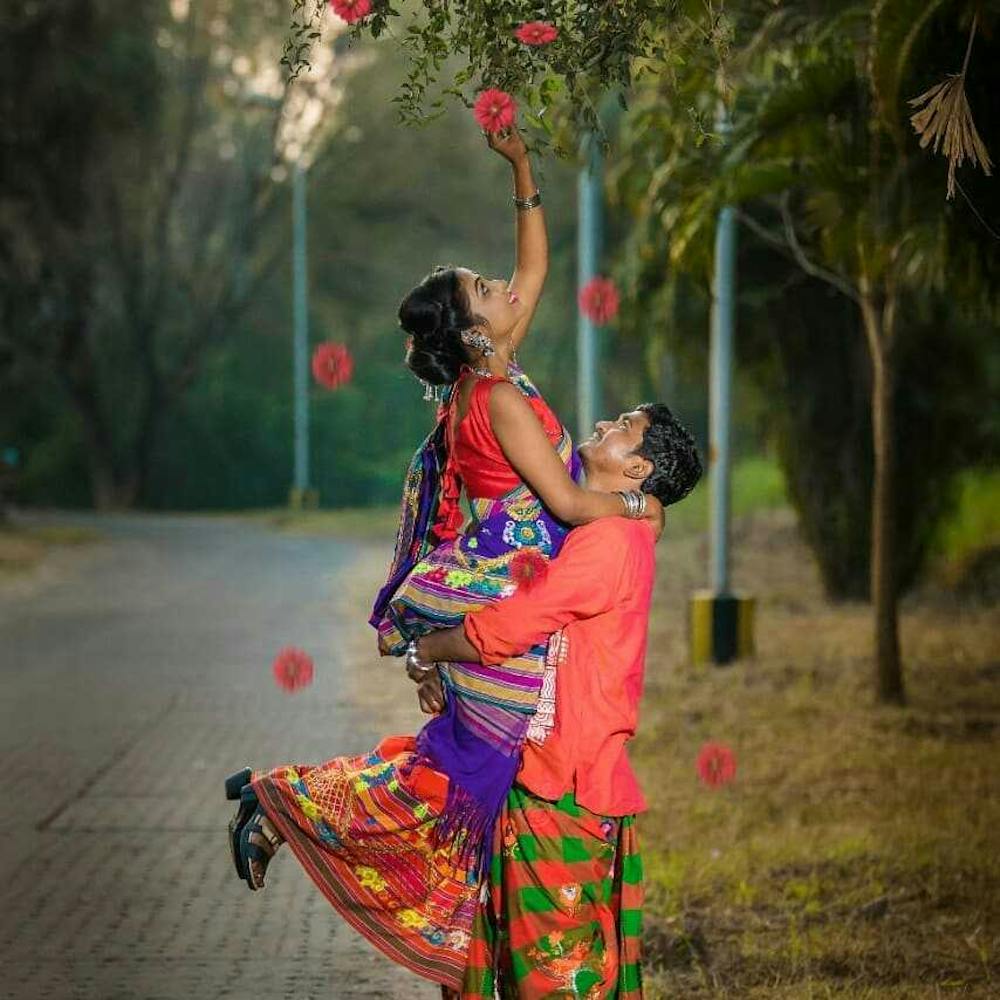 Groom lifting his bride up for a candid pic