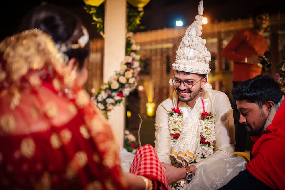 Bengali groom with 'Topor' on his head look
