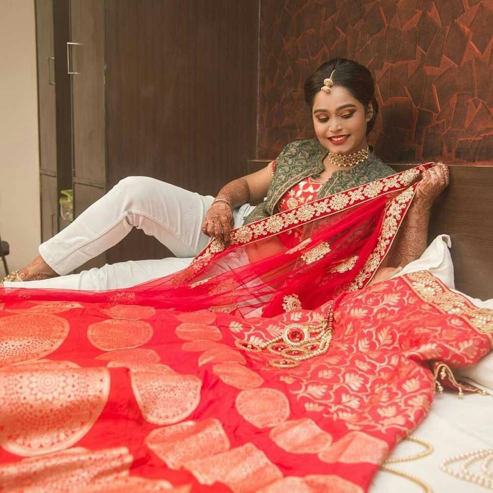 Bride posing with her wedding lehenga pic